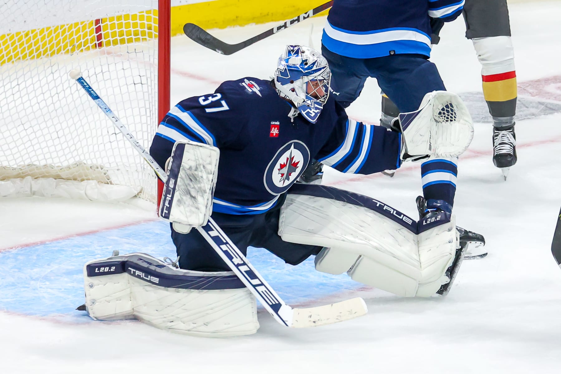 WINNIPEG, CANADA - APRIL 22: Goaltender Connor Hellebuyck #37 of the Winnipeg Jets reacts to a shot during action in the first overtime period against the Vegas Golden Knights in Game Three of the First Round of the 2023 Stanley Cup Playoffs at Canada Life Centre on April 22, 2023 in Winnipeg, Manitoba, Canada. (Photo by Jonathan Kozub/NHLI via Getty Images)