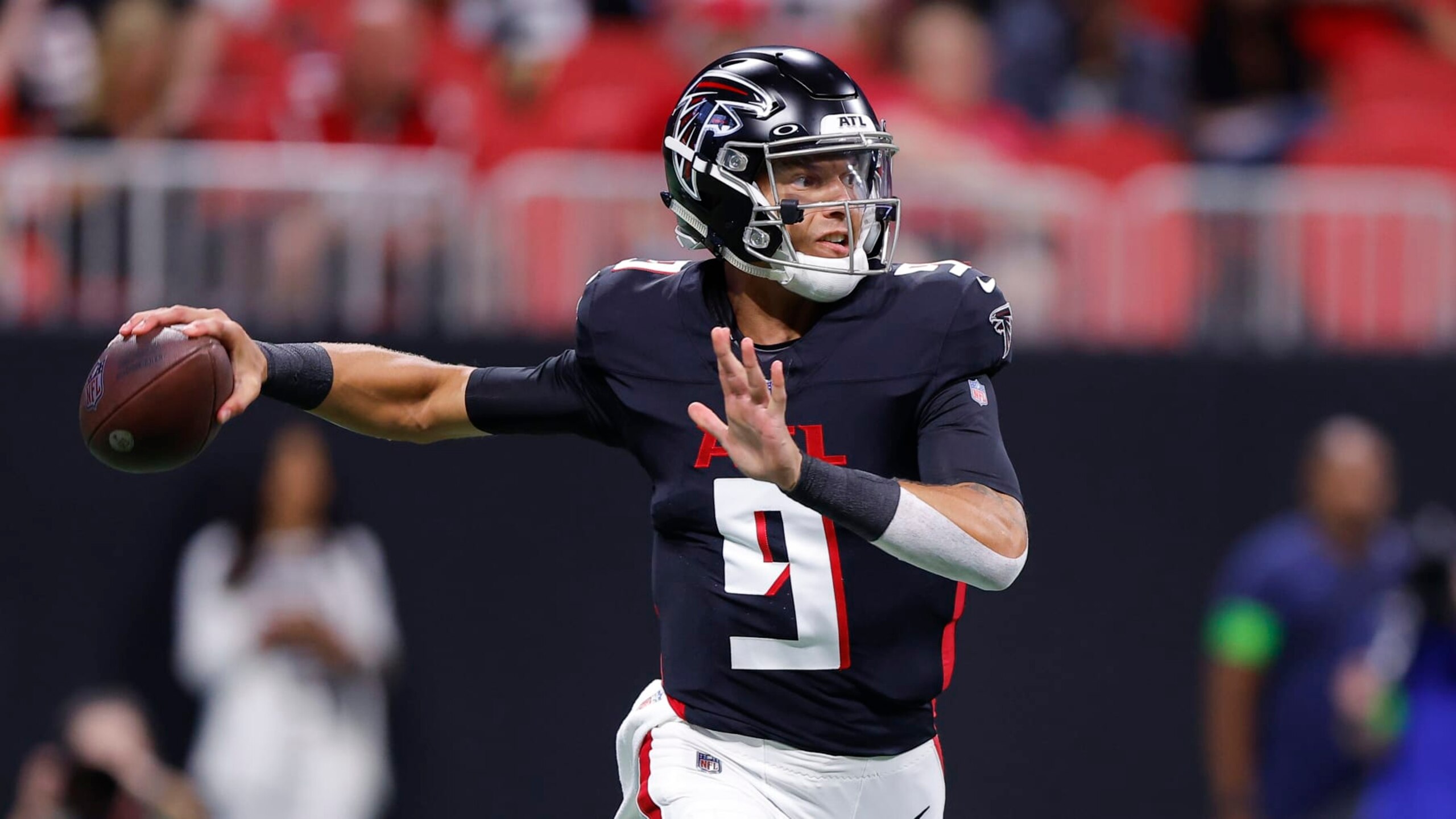 ATLANTA, GEORGIA - AUGUST 18: Desmond Ridder #9 of the Atlanta Falcons rolls out to pass during the first quarter of a preseason game against the Cincinnati Bengals at Mercedes-Benz Stadium on August 18, 2023 in Atlanta, Georgia. (Photo by Todd Kirkland/Getty Images)