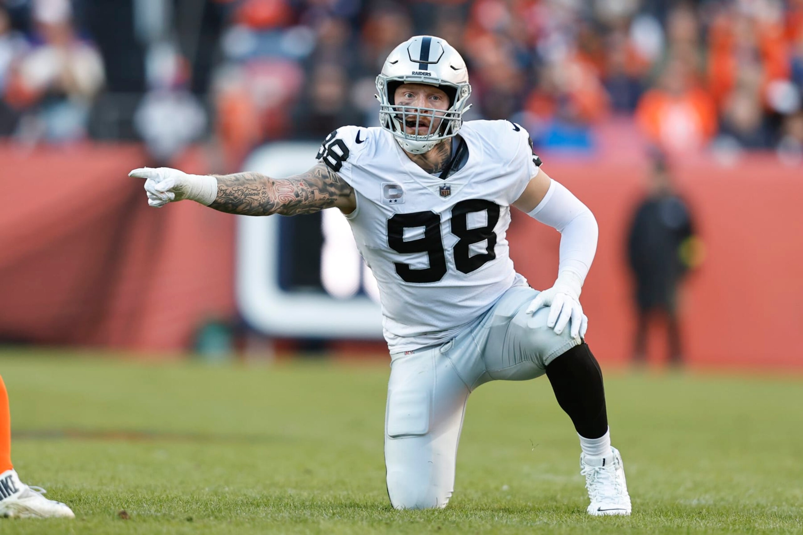 DENVER, COLORADO - NOVEMBER 20: Maxx Crosby #98 of the Las Vegas Raiders signals as he lines up during an NFL game between the Las Vegas Raiders and Denver Broncos at Empower Field At Mile High on November 20, 2022 in Denver, Colorado. (Photo by Michael Owens/Getty Images) DENVER, COLORADO - NOVEMBER 20: Maxx Crosby #98 of the Las Vegas Raiders signals as he lines up during an NFL game between the Las Vegas Raiders and Denver Broncos at Empower Field At Mile High on November 20, 2022 in Denver, Colorado. (Photo by Michael Owens/Getty Images)