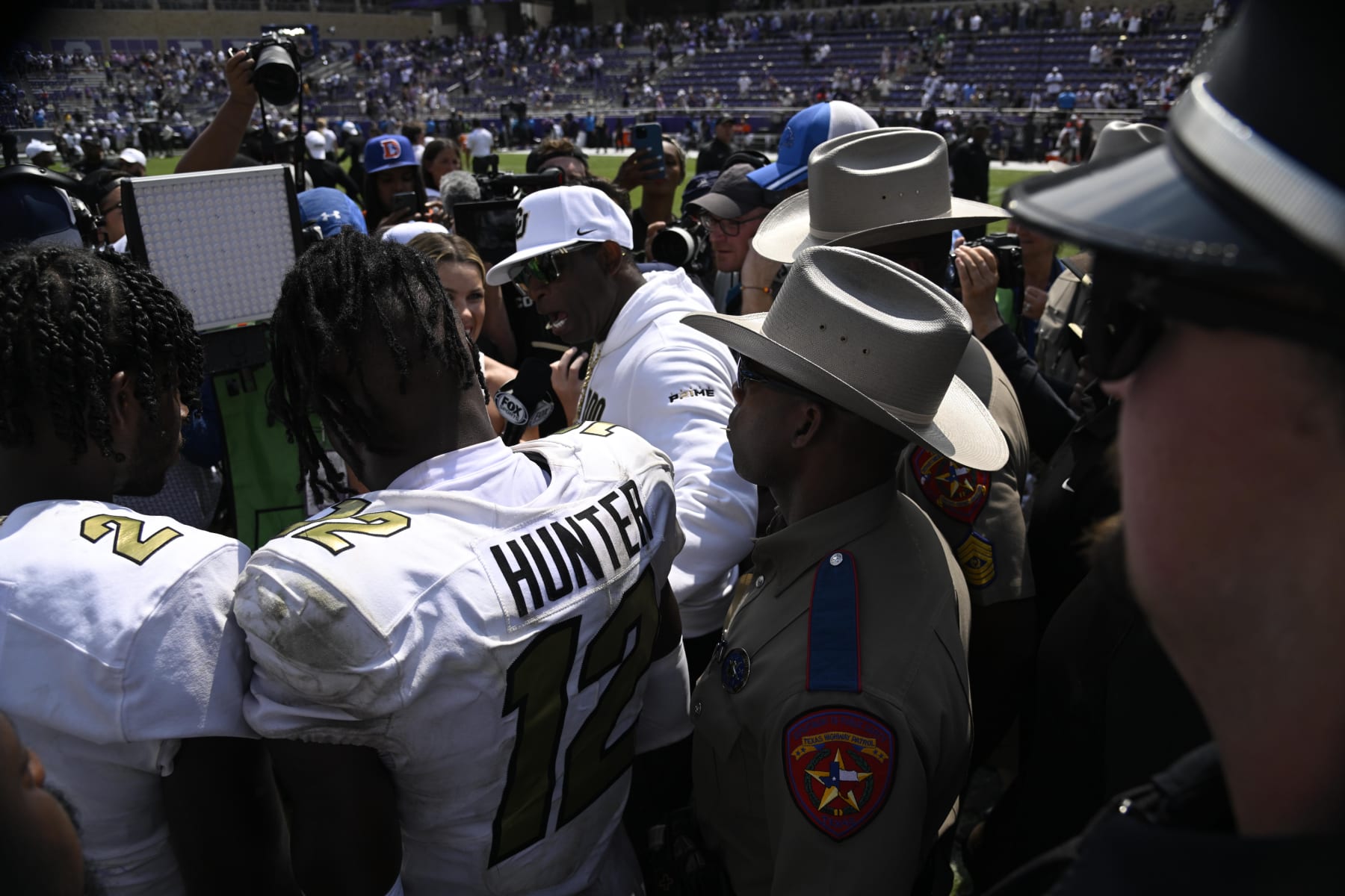 College Football: Colorado head coach Deion Sanders and Travis Hunter (12) are interviewed following victory vs. TCU at Amon G. Carter Stadium. 
Fort Worth, TX 9/2/2023
CREDIT: Greg Nelson (Photo by Greg Nelson/Sports Illustrated via Getty Images) 
(Set Number: X164412 TK1)