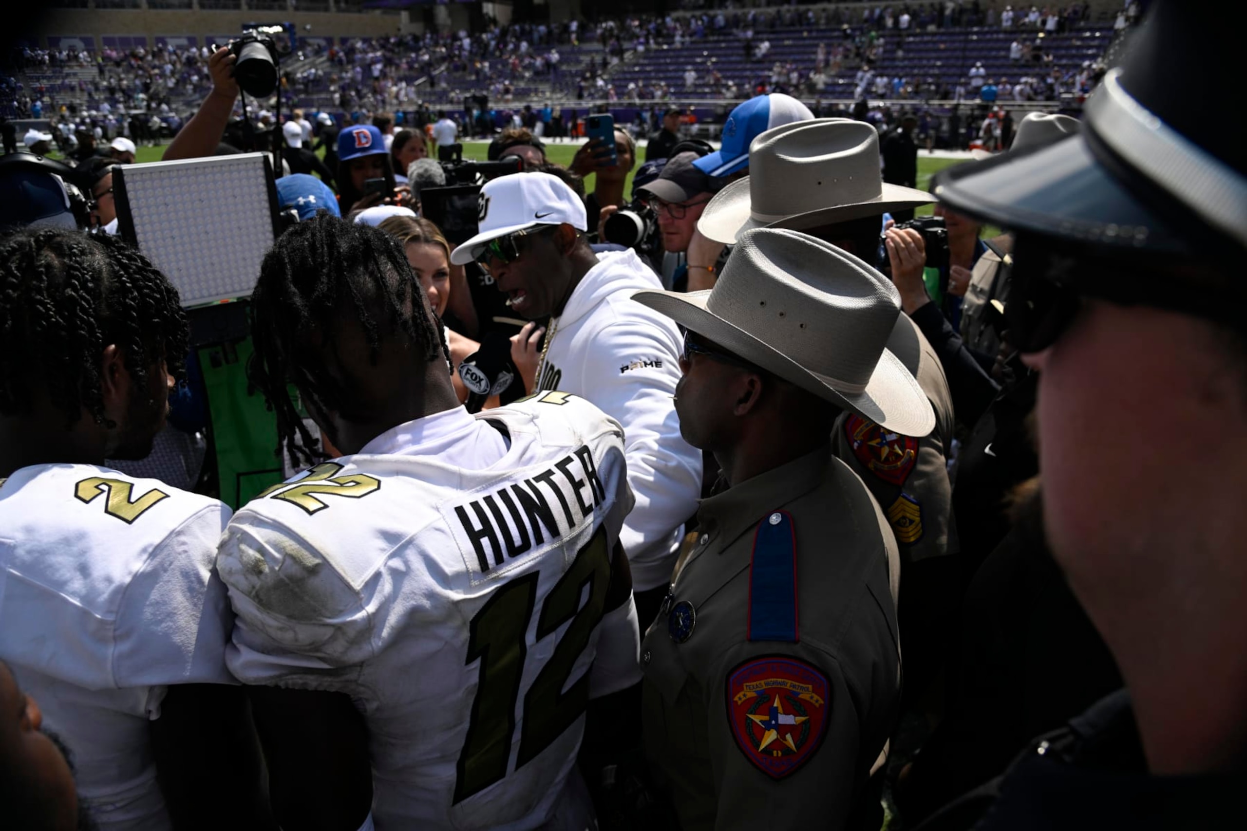 College Football: Colorado head coach Deion Sanders and Travis Hunter (12) are interviewed following victory vs. TCU at Amon G. Carter Stadium. 
Fort Worth, TX 9/2/2023
CREDIT: Greg Nelson (Photo by Greg Nelson/Sports Illustrated via Getty Images) 
(Set Number: X164412 TK1)