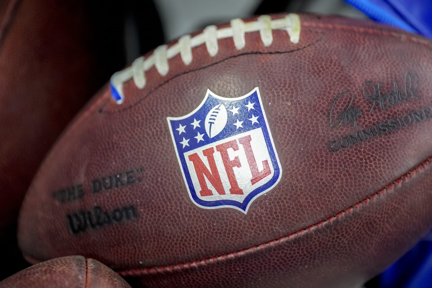 DETROIT, MICHIGAN - AUGUST 19: The NFL logo is pictured on a Wilson brand football during the preseason game between the Detroit Lions and Jacksonville Jaguars at Ford Field on August 19, 2023 in Detroit, Michigan. (Photo by Nic Antaya/Getty Images)