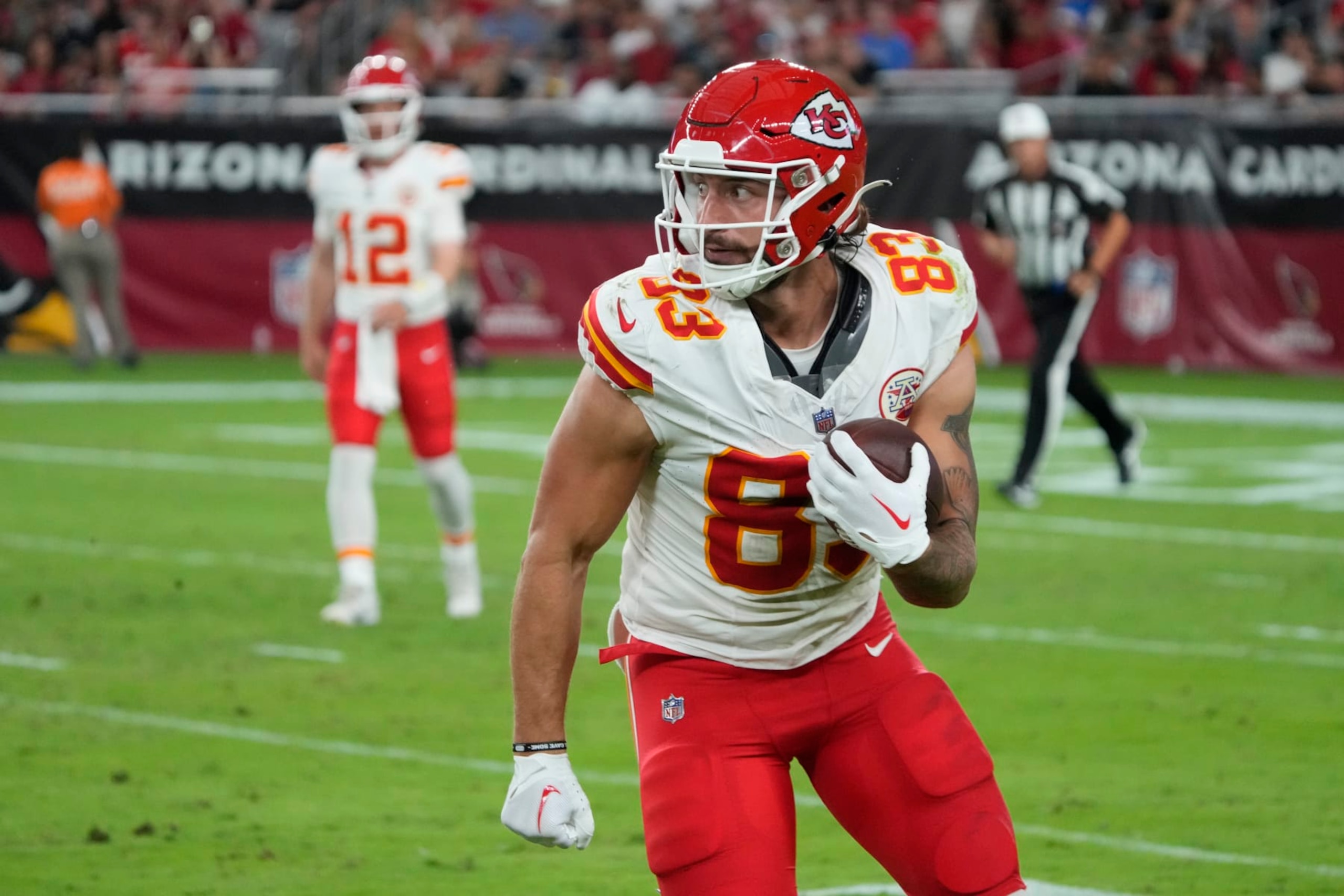 Kansas City Chiefs tight end Noah Gray (83) runs the ball against the Arizona Cardinals during the first half of an NFL pre-season football game, Saturday, Aug. 21, 2023, in Glendale, Ariz. (AP Photo/Rick Scuteri)