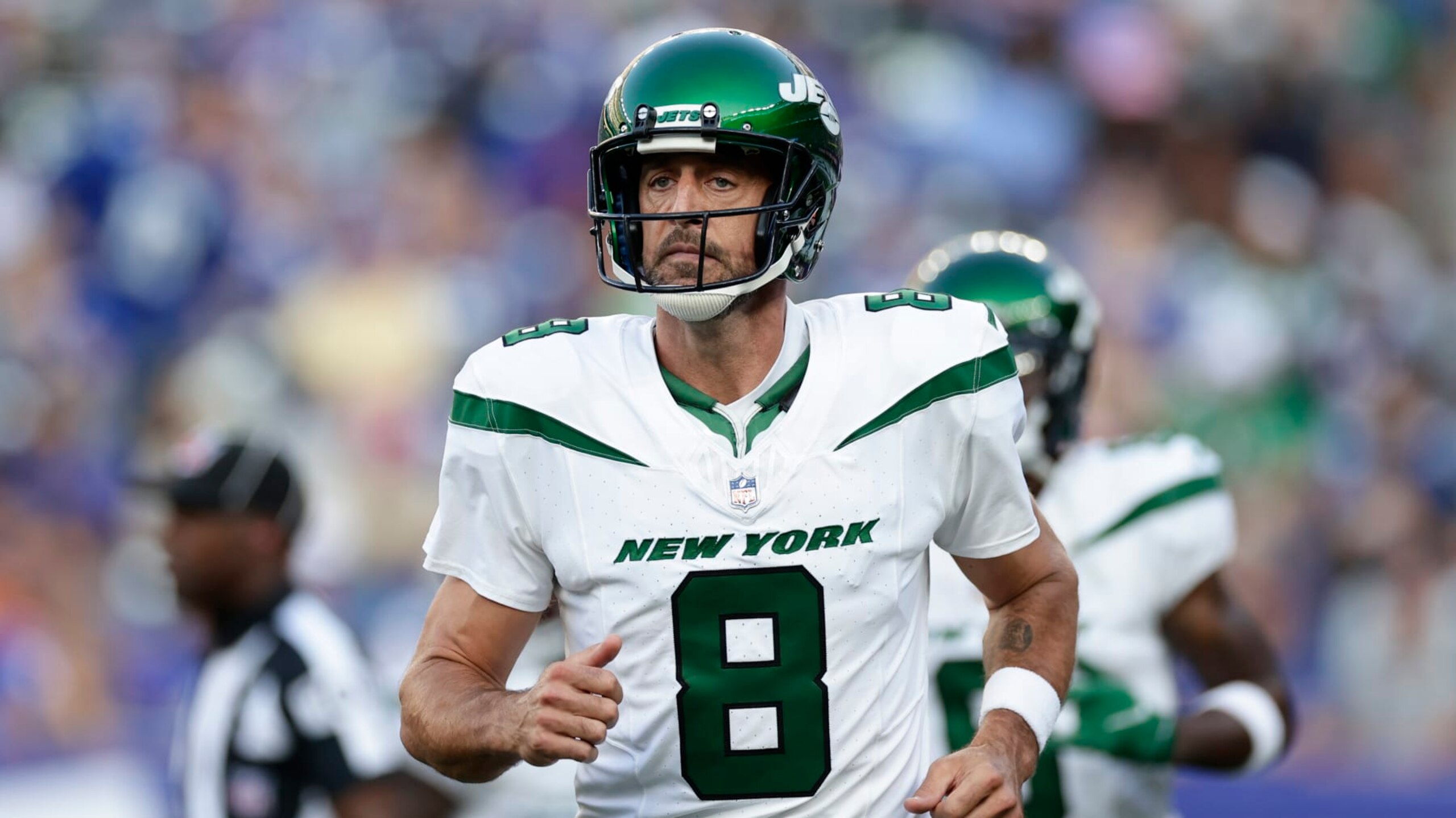 New York Jets quarterback Aaron Rodgers (8) runs the field during the first half of an NFL preseason football game against the New York Giants, Saturday, Aug. 26, 2023, in East Rutherford, N.J. (AP Photo/Adam Hunger)