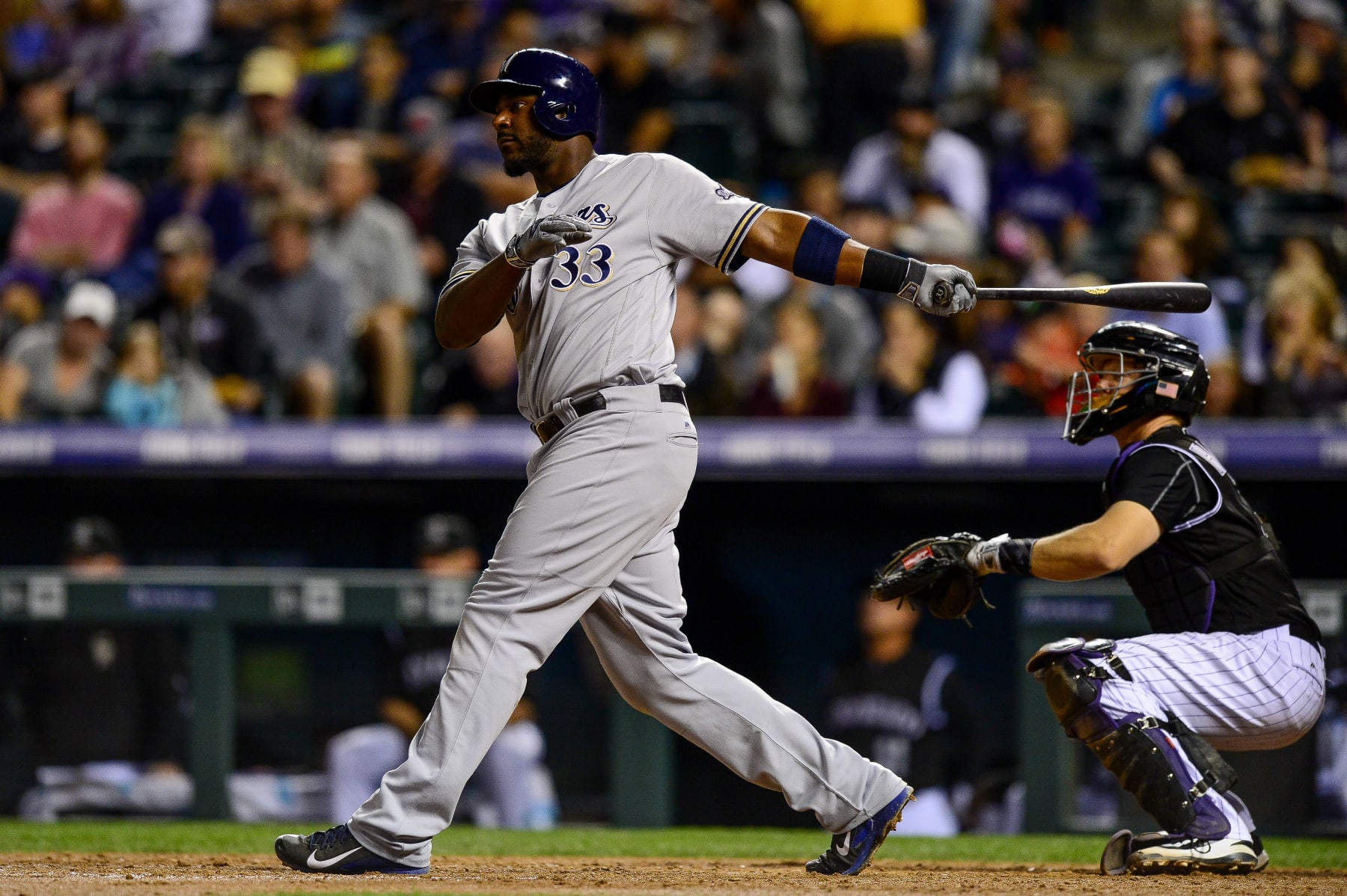 DENVER, CO - SEPTEMBER 30: Chris Carter #33 of the Milwaukee Brewers doubles against the Colorado Rockies during a game at Coors Field on September 30, 2016 in Denver, Colorado.  (Photo by Dustin Bradford/Getty Images)