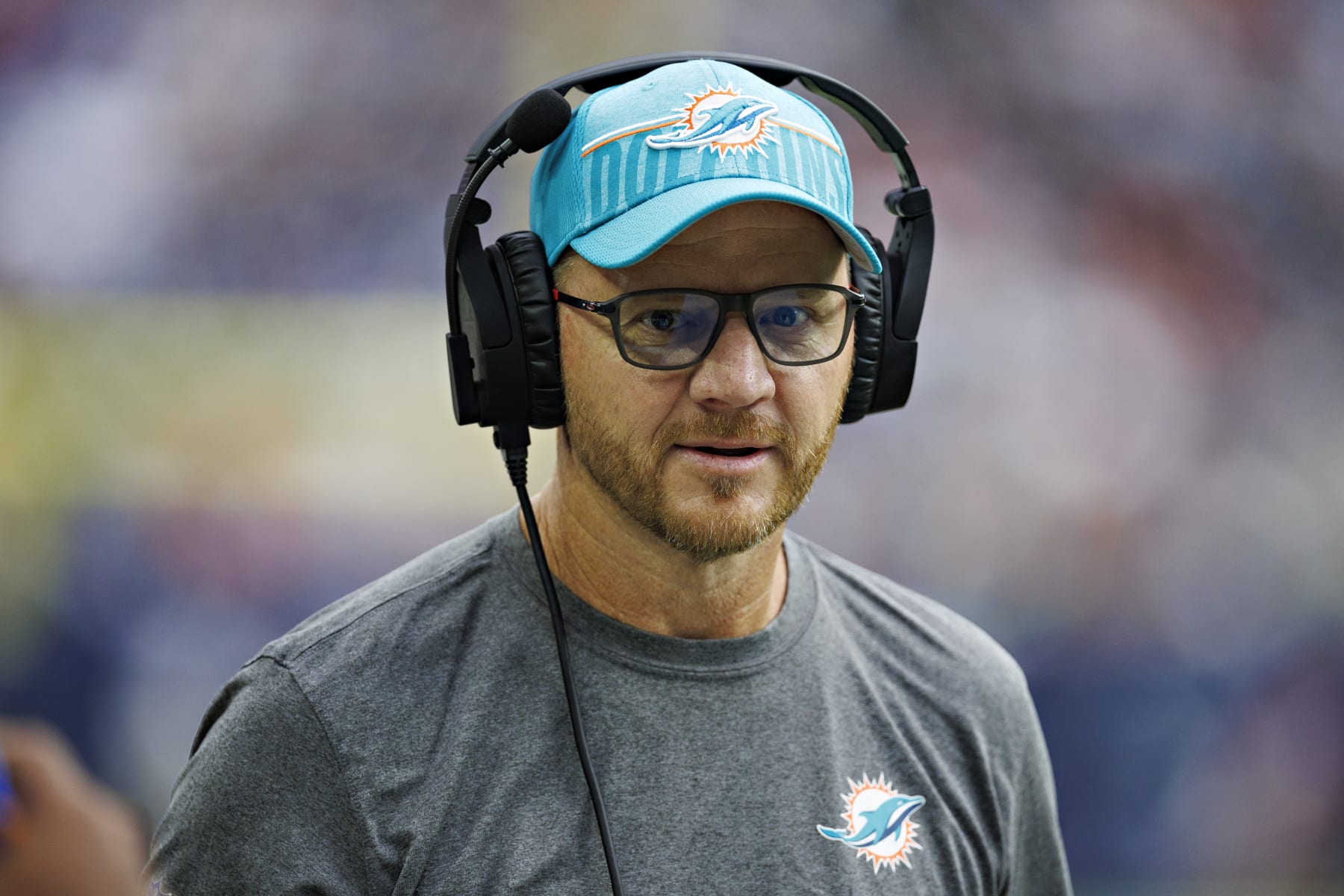 HOUSTON, TEXAS - AUGUST 19:  Quarterback coach Darrell Bevell of the Miami Dolphins on the sidelines during the preseason game against the Houston Texans at NRG Stadium on August 19, 2023 in Houston, Texas. The Dolphins defeated the Texans 28-3.  (Photo by Wesley Hitt/Getty Images)