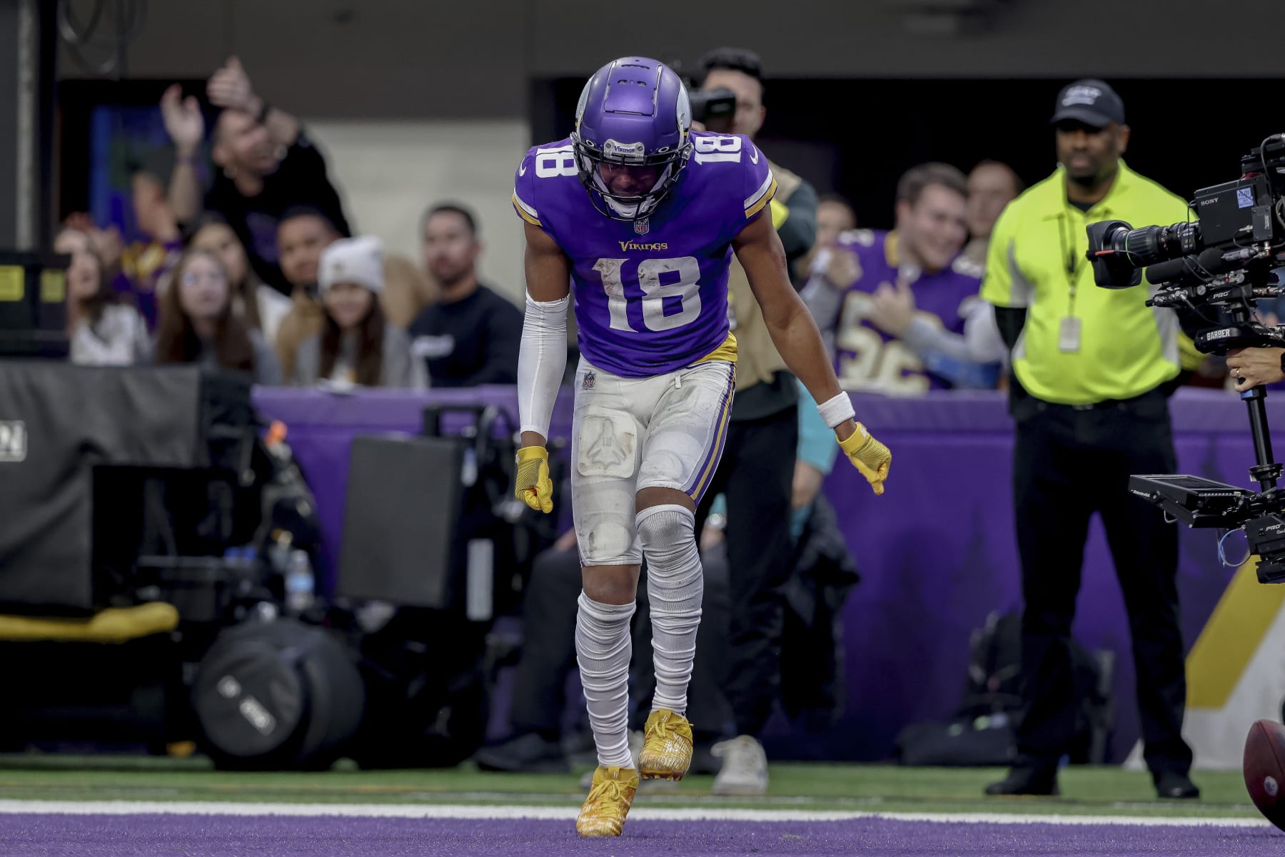 Minnesota Vikings wide receiver Justin Jefferson (18) celebrates in the end zone after scoring a touchdown against the Indianapolis Colts during the second half of an NFL football game Saturday, Dec. 17, 2022 in Minneapolis. (AP Photo/Stacy Bengs)