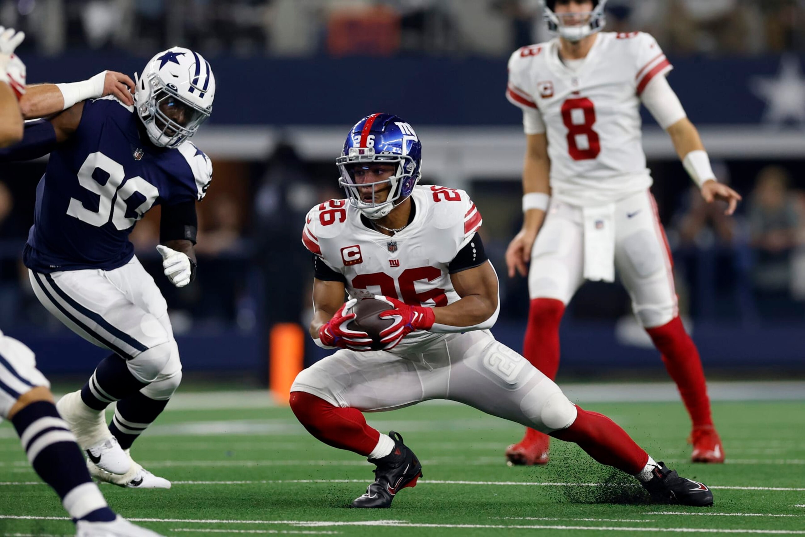 ARLINGTON, TEXAS - NOVEMBER 24: Saquon Barkley #26 of the New York Giants runs the ball during the first half in the game against the Dallas Cowboys at AT&T Stadium on November 24, 2022 in Arlington, Texas. (Photo by Wesley Hitt/Getty Images)