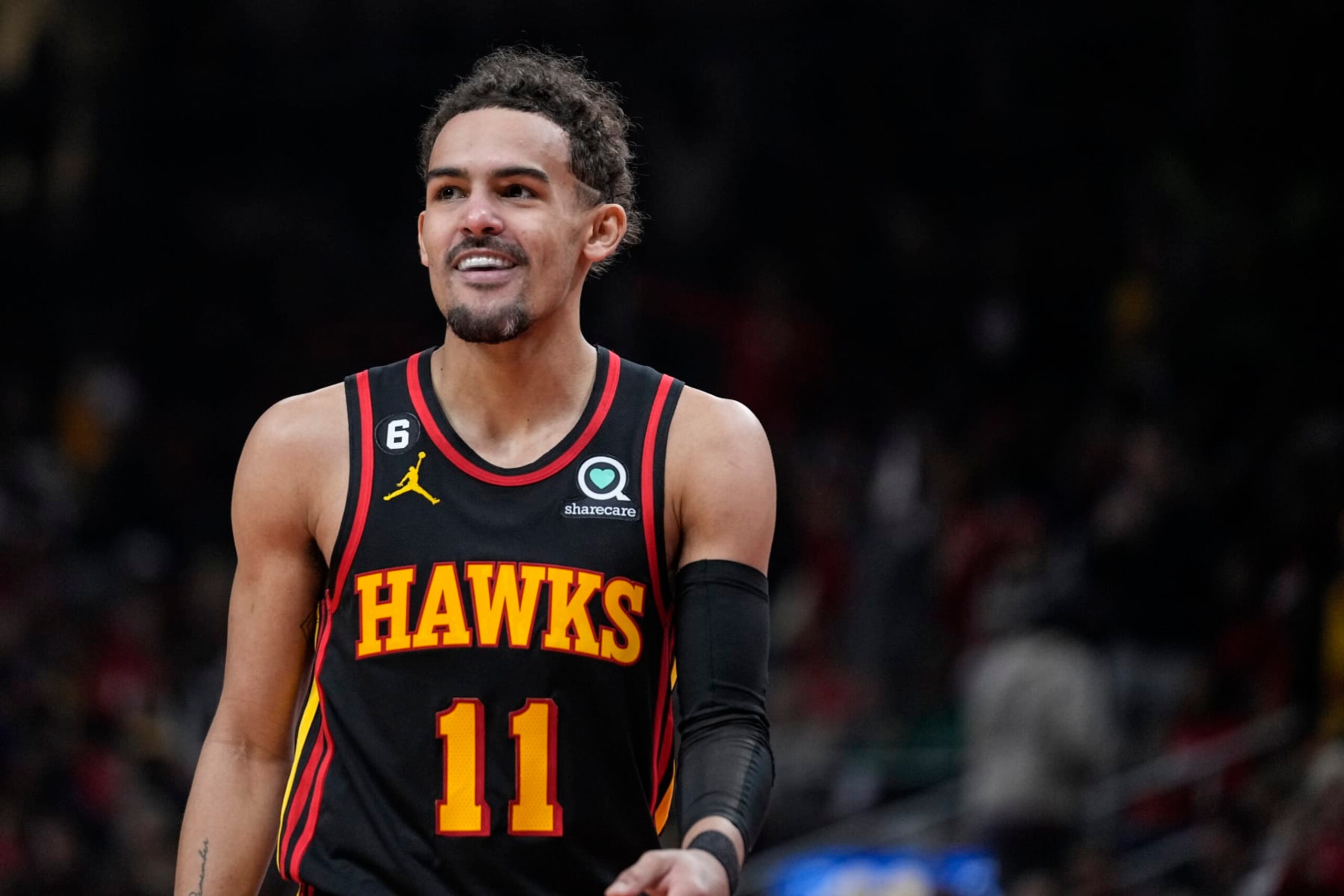 Atlanta Hawks guard Trae Young (11) smiles to the fans after scoring against the Boston Celtics during the first half of Game 6 of a first-round NBA basketball playoff series, Thursday, April 27, 2023, in Atlanta. (AP Photo/Brynn Anderson)