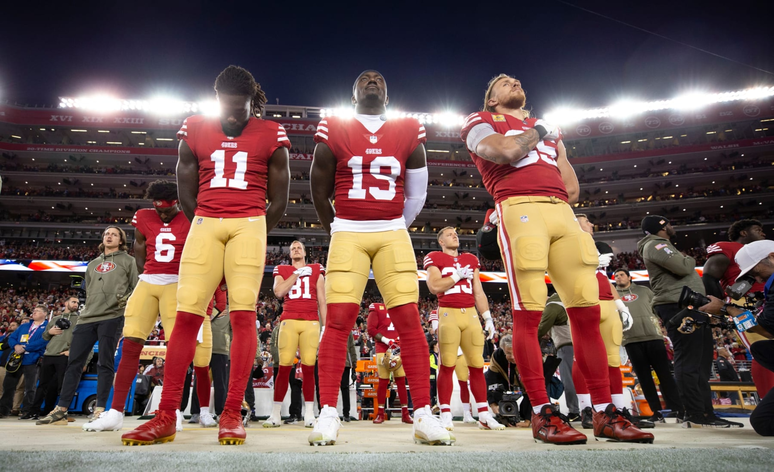 SANTA CLARA, CA - NOVEMBER 13: Brandon Aiyuk #11, Deebo Samuel #19 and George Kittle #85 of the San Francisco 49ers during the anthem before game against the Los Angeles Chargers at Levi's Stadium on November 13, 2022 in Santa Clara, California. The 49ers defeated the Chargers 22-16. (Photo by Michael Zagaris/San Francisco 49ers/Getty Images)