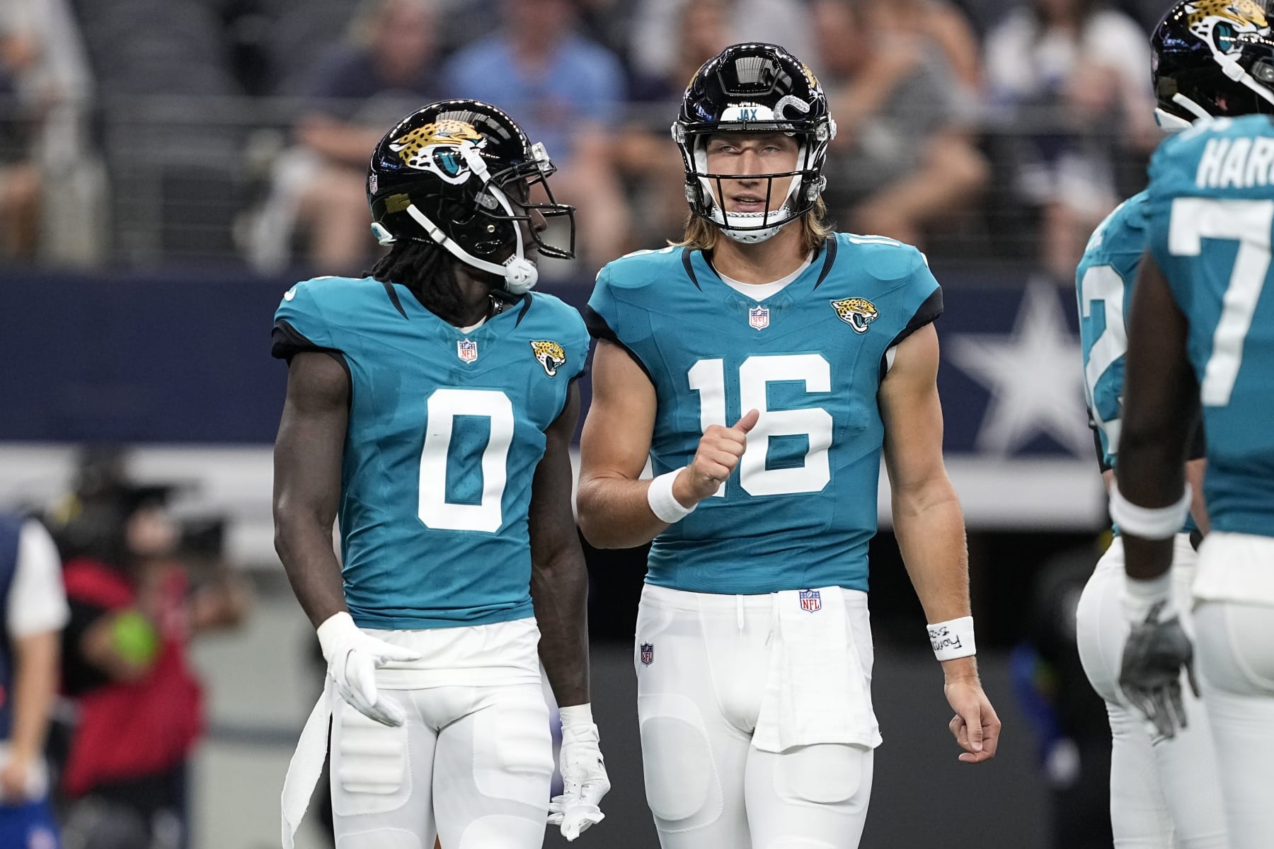 Jacksonville Jaguars wide receiver Calvin Ridley (left) and quarterback Trevor Lawrence (right)