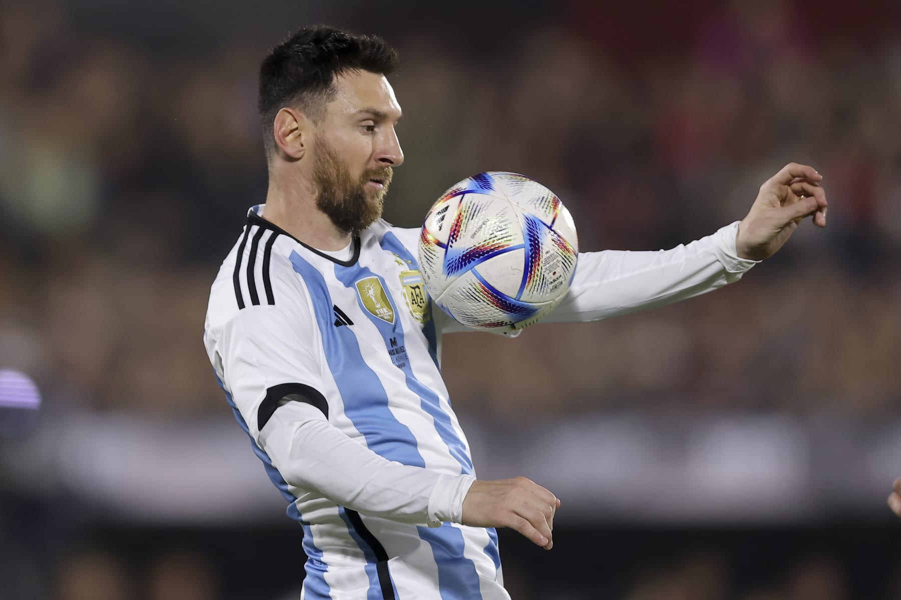 Lionel Messi controls the ball during Argentine soccer player Maximiliano Rodriguez's farewell match at the Marcelo Bielsa stadium in Rosario, Argentina, Saturday, June 24, 2023.(AP Photo/Nicolas Aguilera)