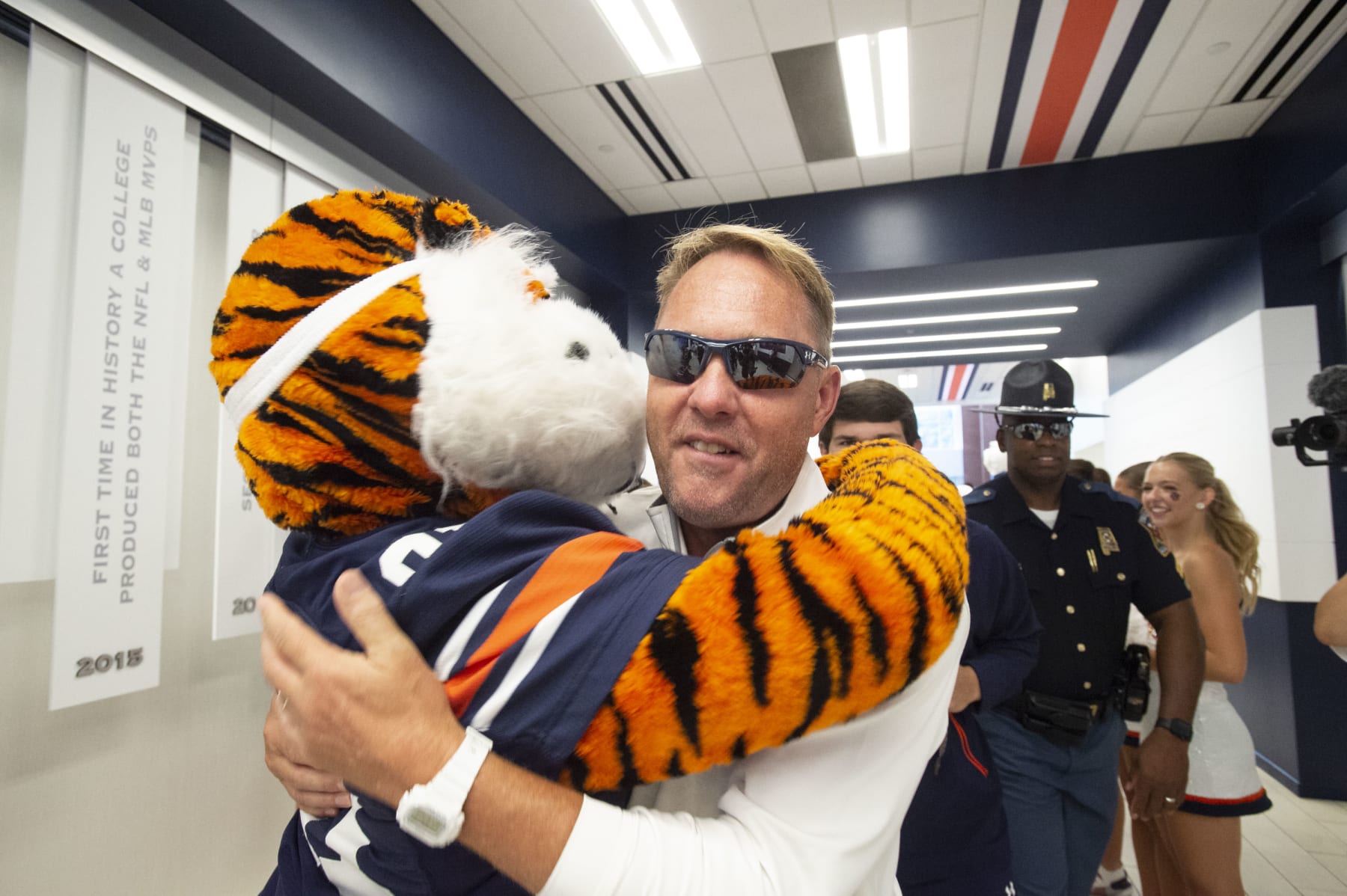 AUBURN, ALABAMA - SEPTEMBER 02: Head coach Hugh Freeze of the Auburn Tigers hugs mascot Aubie of the Auburn Tigers prior to their game against the Massachusetts Minutemen at Jordan-Hare Stadium on September 02, 2023 in Auburn, Alabama. (Photo by Michael Chang/Getty Images)