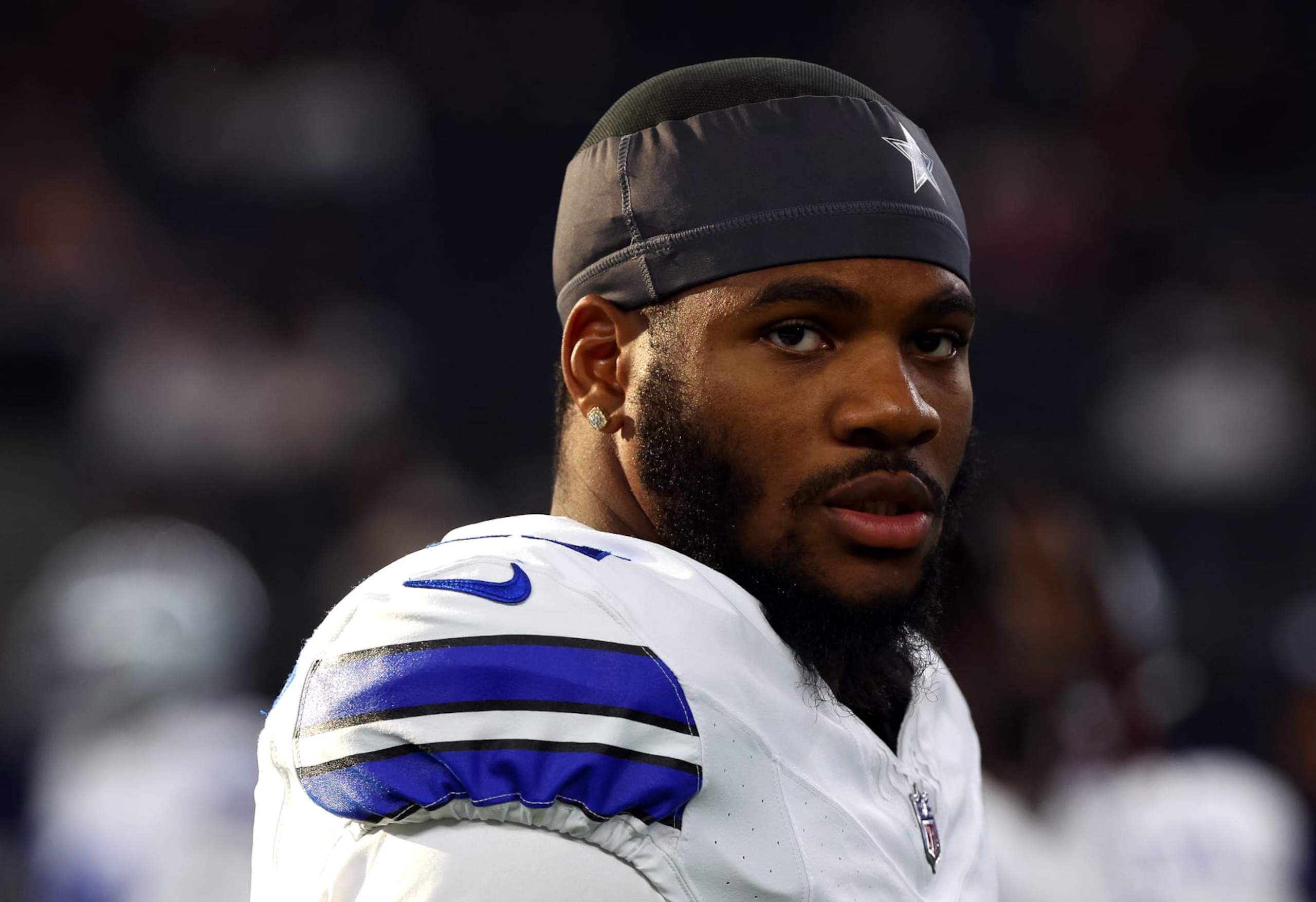 ARLINGTON, TEXAS - AUGUST 26: Micah Parsons #11 of the Dallas Cowboys walks off the field after warmups before a preseason game against the Las Vegas Raiders at AT&T Stadium on August 26, 2023 in Arlington, Texas. (Photo by Richard Rodriguez/Getty Images)