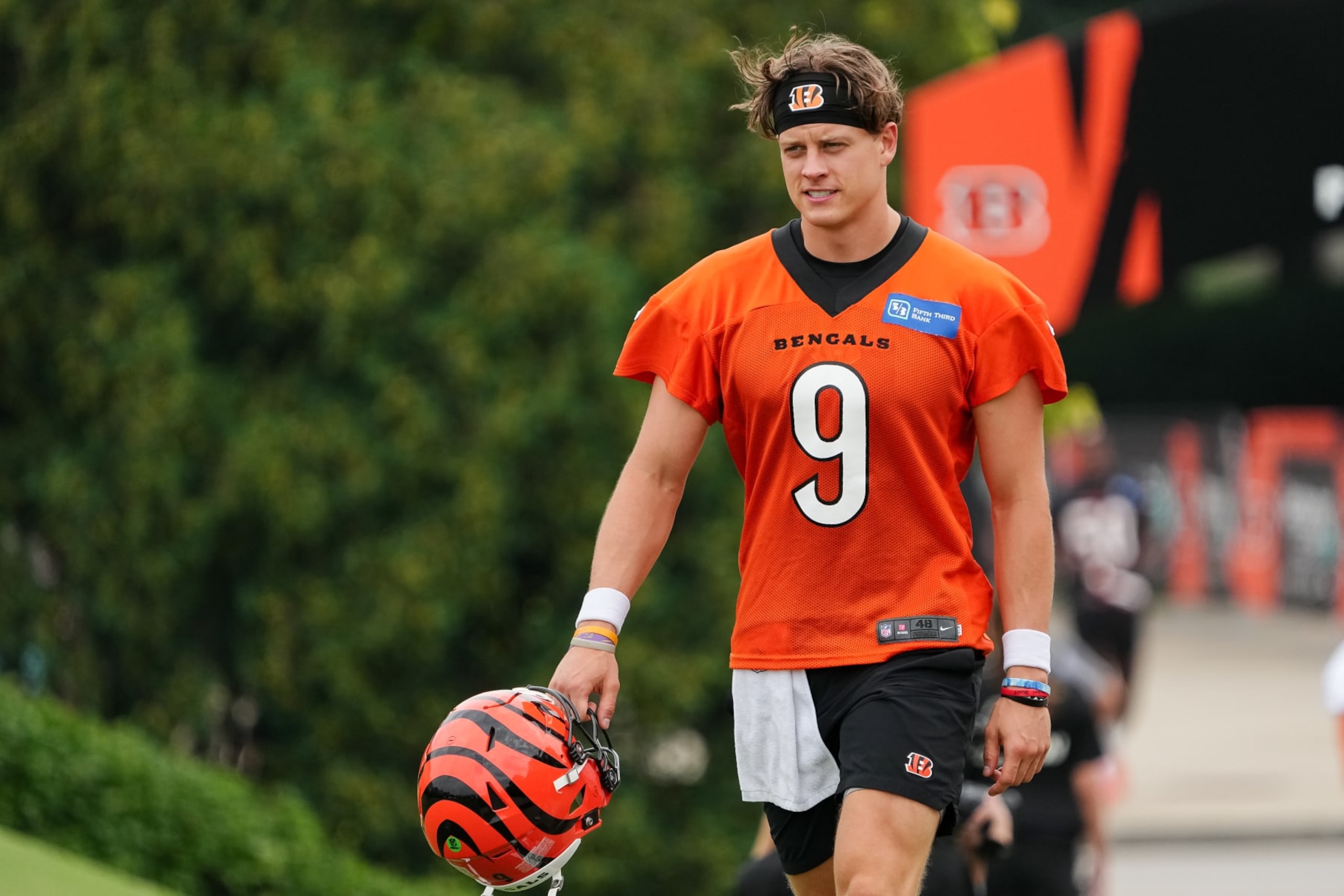 CINCINNATI, OHIO - JULY 26: Joe Burrow #9 of the Cincinnati Bengals walks to the field during training camp at Kettering Health Practice Fields on July 26, 2023 in Cincinnati, Ohio. (Photo by Dylan Buell/Getty Images)