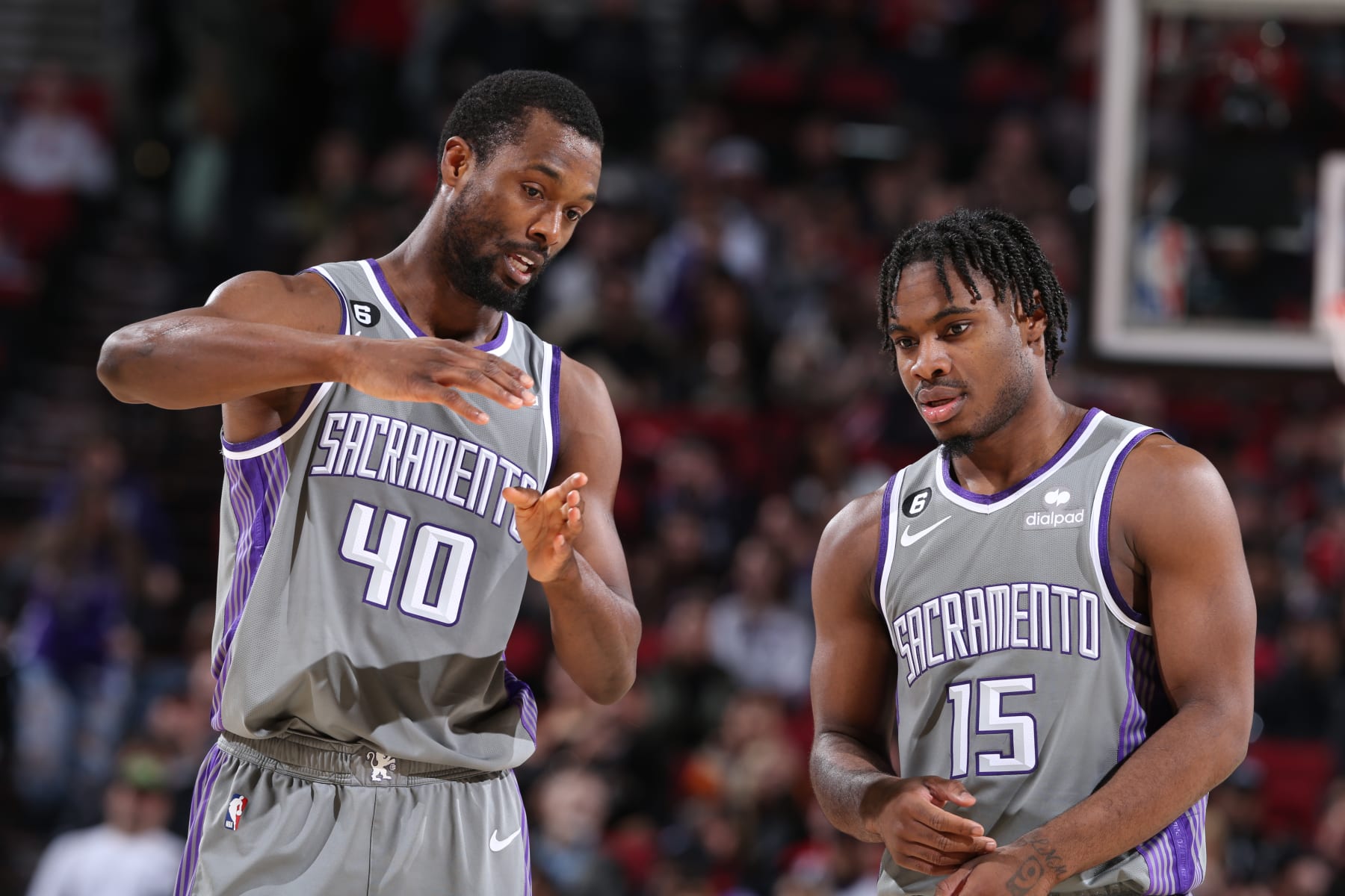 PORTLAND, OR - MARCH 29:  Davion Mitchell #15 and Harrison Barnes #40 of the Sacramento Kings looks on during the game on March 29, 2023 at the Moda Center Arena in Portland, Oregon. NOTE TO USER: User expressly acknowledges and agrees that, by downloading and or using this photograph, user is consenting to the terms and conditions of the Getty Images License Agreement. Mandatory Copyright Notice: Copyright 2023 NBAE (Photo by Sam Forencich/NBAE via Getty Images)