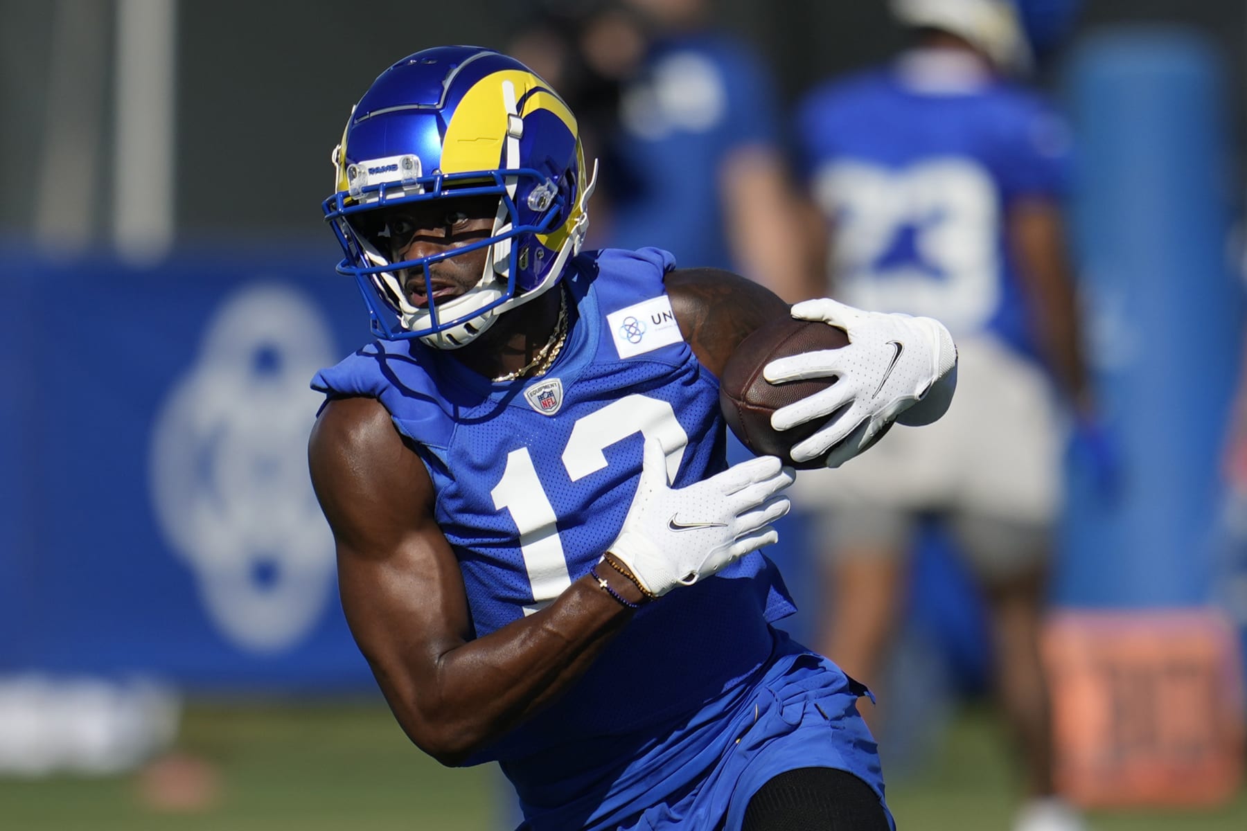 Los Angeles Rams wide receiver Van Jefferson (12) runs after a catch during the NFL football team's training camp Wednesday, July 26, 2023, in Irvine, Calif. (AP Photo/Marcio Jose Sanchez)