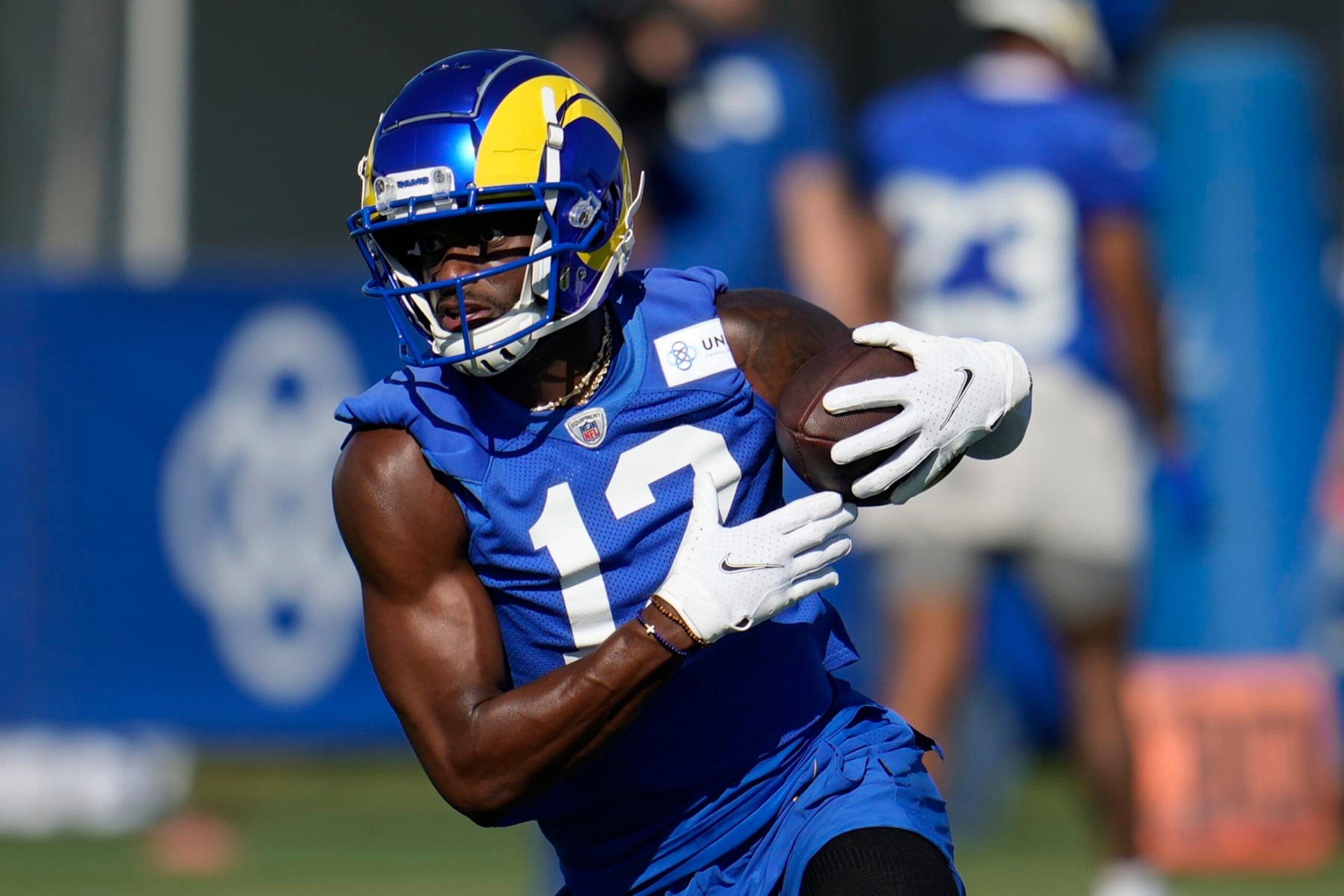 Los Angeles Rams wide receiver Van Jefferson (12) runs after a catch during the NFL football team's training camp Wednesday, July 26, 2023, in Irvine, Calif. (AP Photo/Marcio Jose Sanchez)