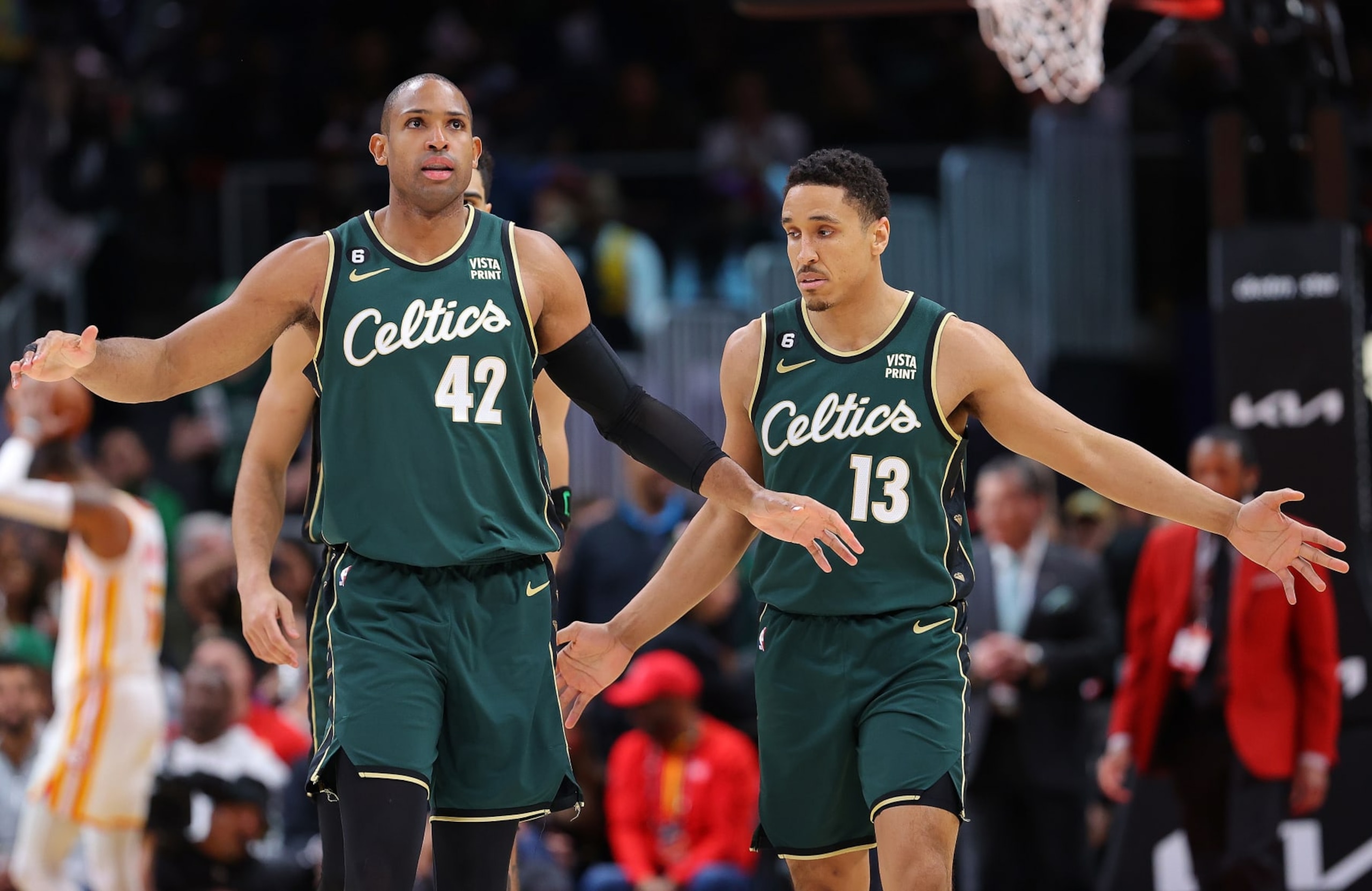 ATLANTA, GEORGIA - MARCH 11:  Al Horford #42 and Malcolm Brogdon #13 of the Boston Celtics react against the Atlanta Hawks during the fourth quarter at State Farm Arena on March 11, 2023 in Atlanta, Georgia.  NOTE TO USER: User expressly acknowledges and agrees that, by downloading and or using this photograph, User is consenting to the terms and conditions of the Getty Images License Agreement.  (Photo by Kevin C. Cox/Getty Images)