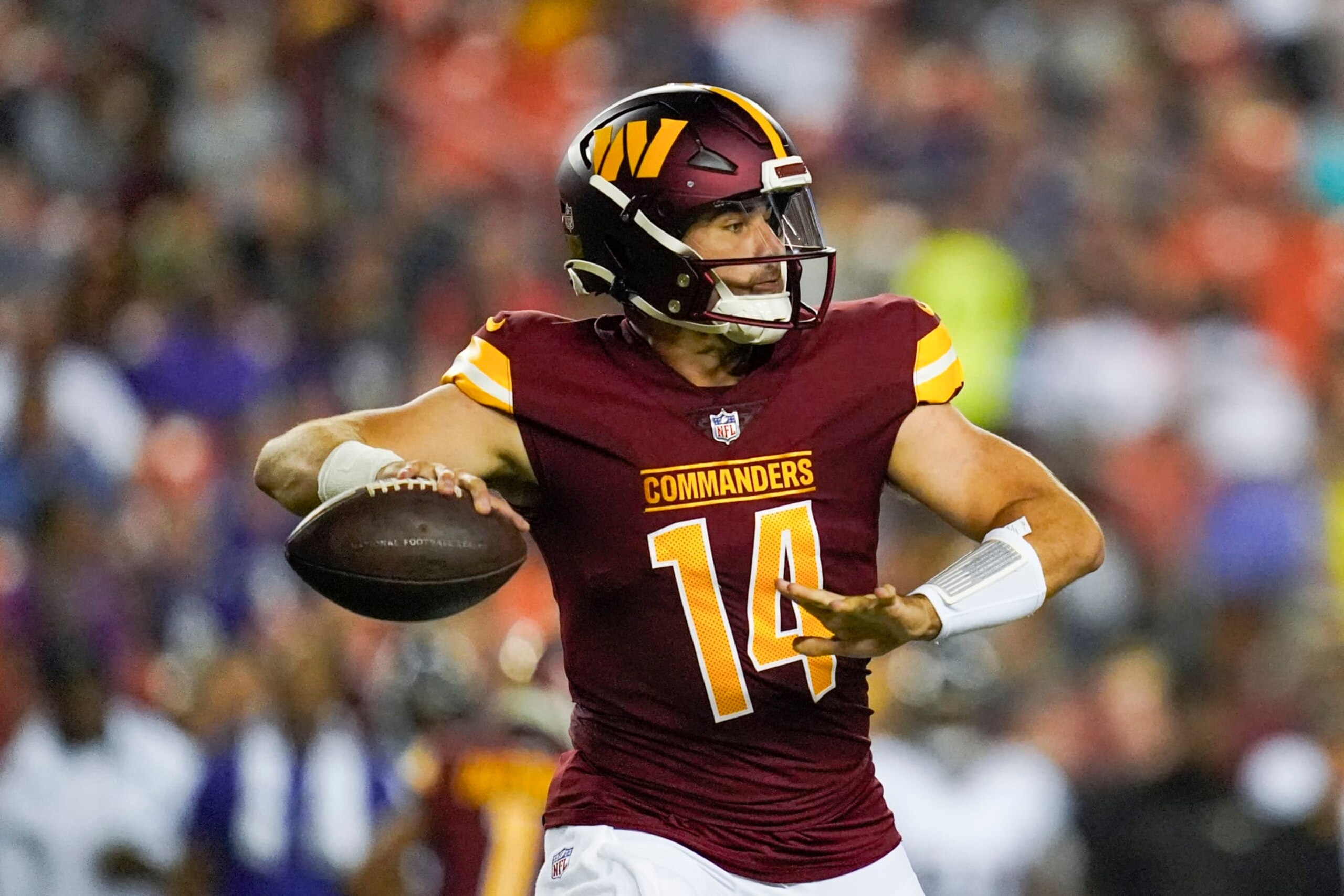 Washington Commanders quarterback Sam Howell looks to pass during the first half of an NFL preseason football game against the Baltimore Ravens, Monday, Aug. 21, 2023, in Landover, Md. (AP Photo/Stephanie Scarbrough)