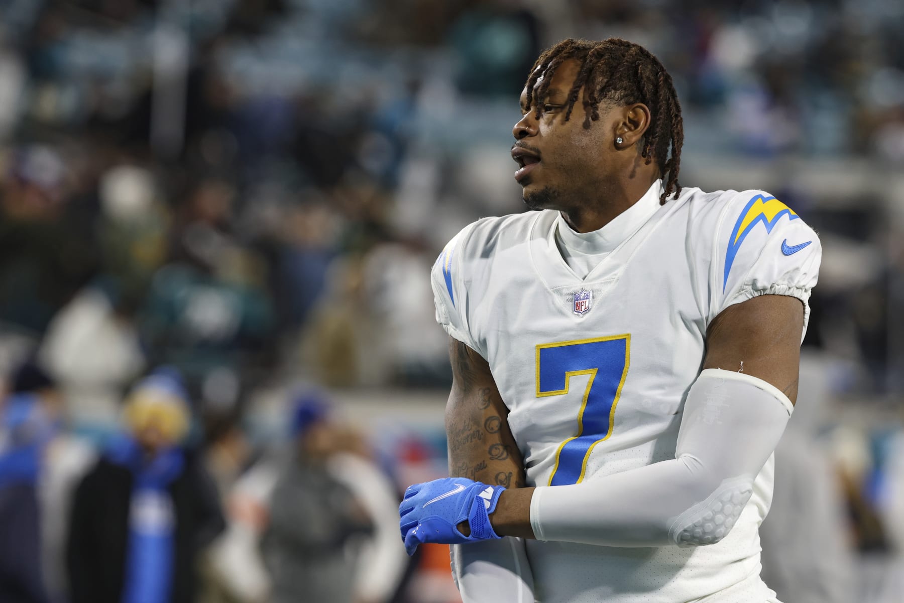 Los Angeles Chargers tight end Gerald Everett (7) warms up before an NFL wild-card football game against the Jacksonville Jaguars, Saturday, Jan. 14, 2023, in Jacksonville, Fla. The Jaguars defeated the Chargers 31-30. (AP Photo/Gary McCullough)