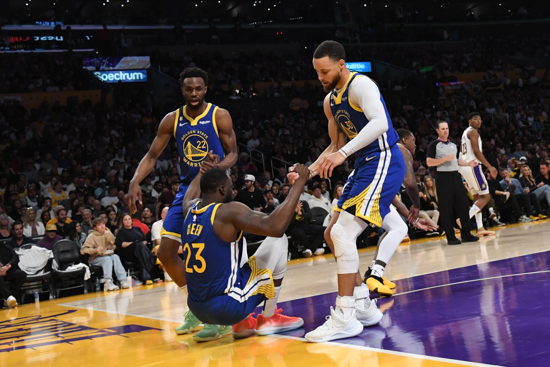 LOS ANGELES, CA - MAY 6: Andrew Wiggins #22 and Stephen Curry #30 help up Draymond Green #23 of the Golden State Warriors during the game against the Los Angeles Lakers during the Western Conference Semi Finals during the 2023 NBA Playoffs on May 6, 2023 at Crypto.Com Arena in Los Angeles, California. NOTE TO USER: User expressly acknowledges and agrees that, by downloading and/or using this Photograph, user is consenting to the terms and conditions of the Getty Images License Agreement. Mandatory Copyright Notice: Copyright 2023 NBAE (Photo by Noah Graham/NBAE via Getty Images)