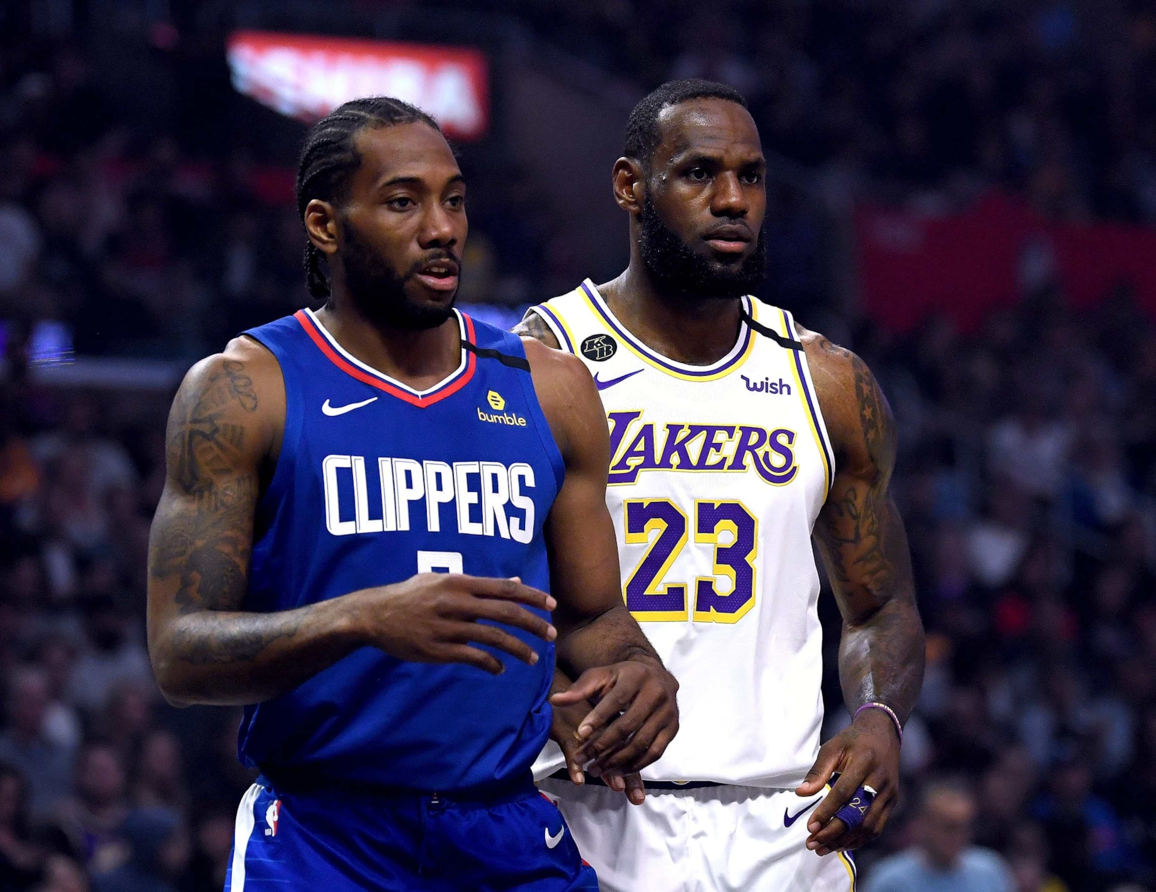 LOS ANGELES, CALIFORNIA - MARCH 08: Kawhi Leonard #2 of the LA Clipper and LeBron James #23 of the Los Angeles Lakers during the first half at Staples Center on March 08, 2020 in Los Angeles, California. NOTE TO USER: User expressly acknowledges and agrees that, by downloading and or using this photograph, User is consenting to the terms and conditions of the Getty Images License Agreement. (Photo by Harry How/Getty Images) LOS ANGELES, CALIFORNIA - MARCH 08: Kawhi Leonard #2 of the LA Clipper and LeBron James #23 of the Los Angeles Lakers during the first half at Staples Center on March 08, 2020 in Los Angeles, California. NOTE TO USER: User expressly acknowledges and agrees that, by downloading and or using this photograph, User is consenting to the terms and conditions of the Getty Images License Agreement. (Photo by Harry How/Getty Images)