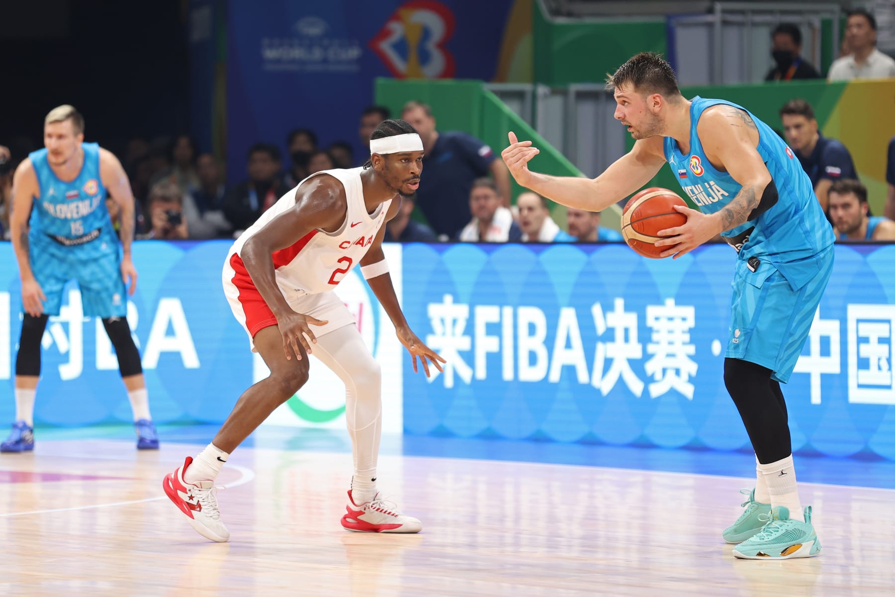 MANILA, PHILIPPINES - SEPTEMBER 6: Shai Gilgeous-Alexander of Canada plays defense on Luka Doncic of Slovenia as part of the 2023 FIBA World Cup on September 6, 2023 at Mall of Asia Arena in Manila, Philippines. NOTE TO USER: User expressly acknowledges and agrees that, by downloading and/or using this photograph, user is consenting to the terms and conditions of the Getty Images License Agreement. Mandatory Copyright Notice: Copyright 2023 NBAE (Photo by Stephen Gosling/NBAE via Getty Images)