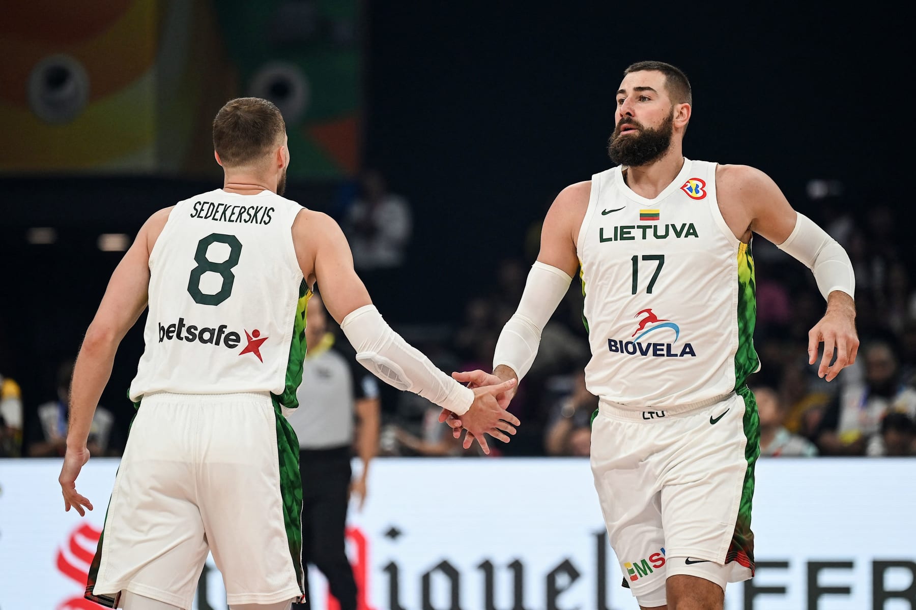 Lithuania's Jonas Valanciunas (R) and Tadas Sedekerskis (L) gestures during the FIBA Basketball World Cup classification match between Slovenia and Lithuania in Manila on September 7, 2023. (Photo by JAM STA ROSA / AFP) (Photo by JAM STA ROSA/AFP via Getty Images)