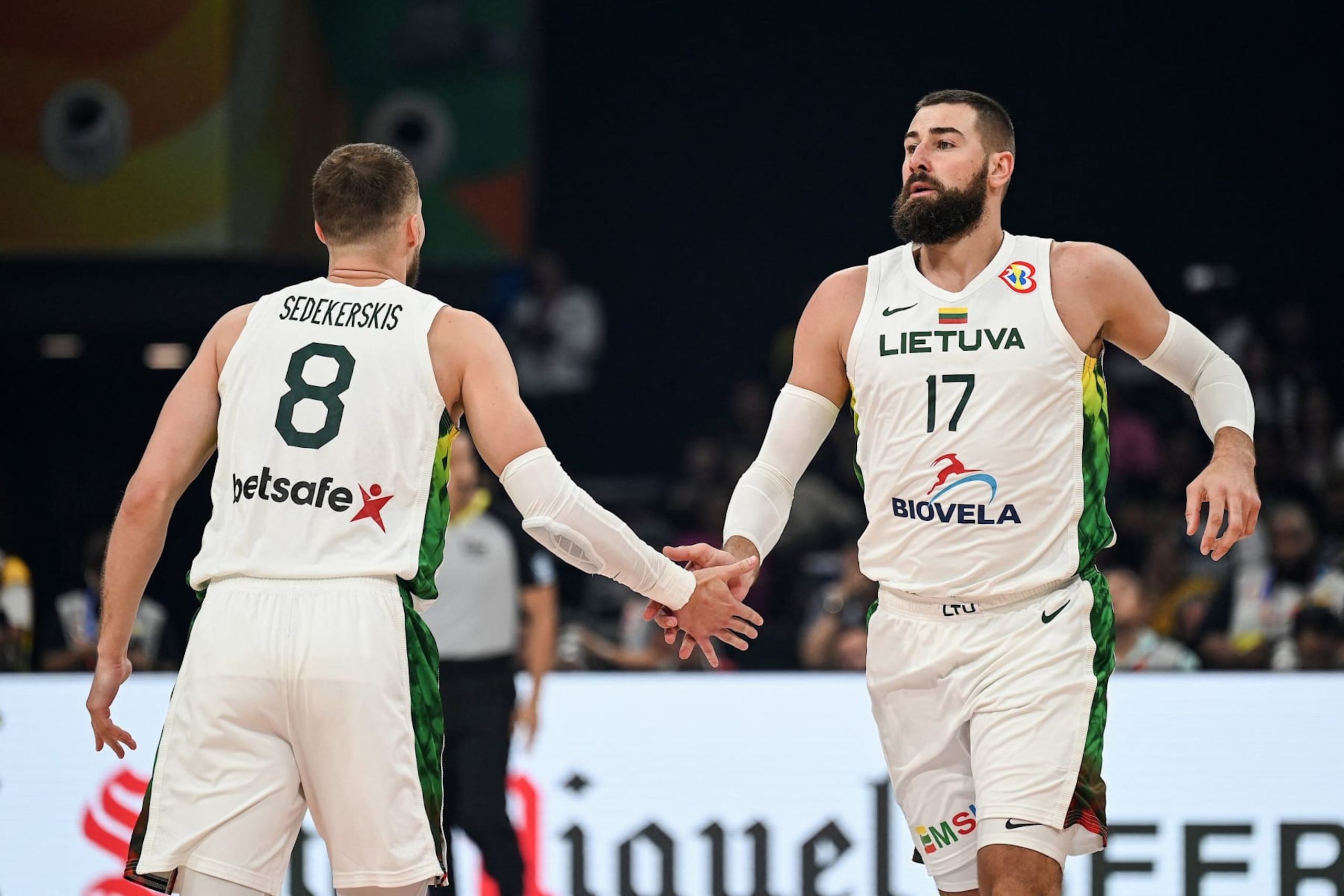 Lithuania's Jonas Valanciunas (R) and Tadas Sedekerskis (L) gestures during the FIBA Basketball World Cup classification match between Slovenia and Lithuania in Manila on September 7, 2023. (Photo by JAM STA ROSA / AFP) (Photo by JAM STA ROSA/AFP via Getty Images)