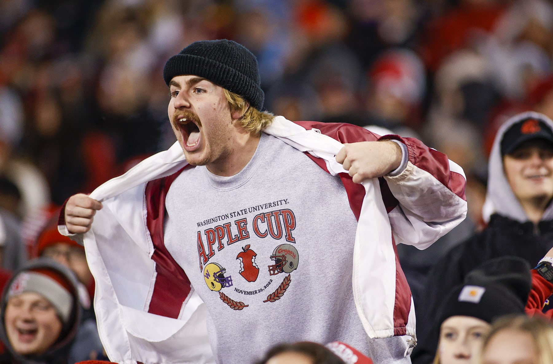 PULLMAN, WA - NOVEMBER 26: A Washington State Cougars fan cheers from the crowd during the game between the Washington Huskies and the Washington State Cougars on November 26, 2022, at Martin Stadium in Pullman, WA. (Photo by Oliver McKenna/Icon Sportswire via Getty Images)