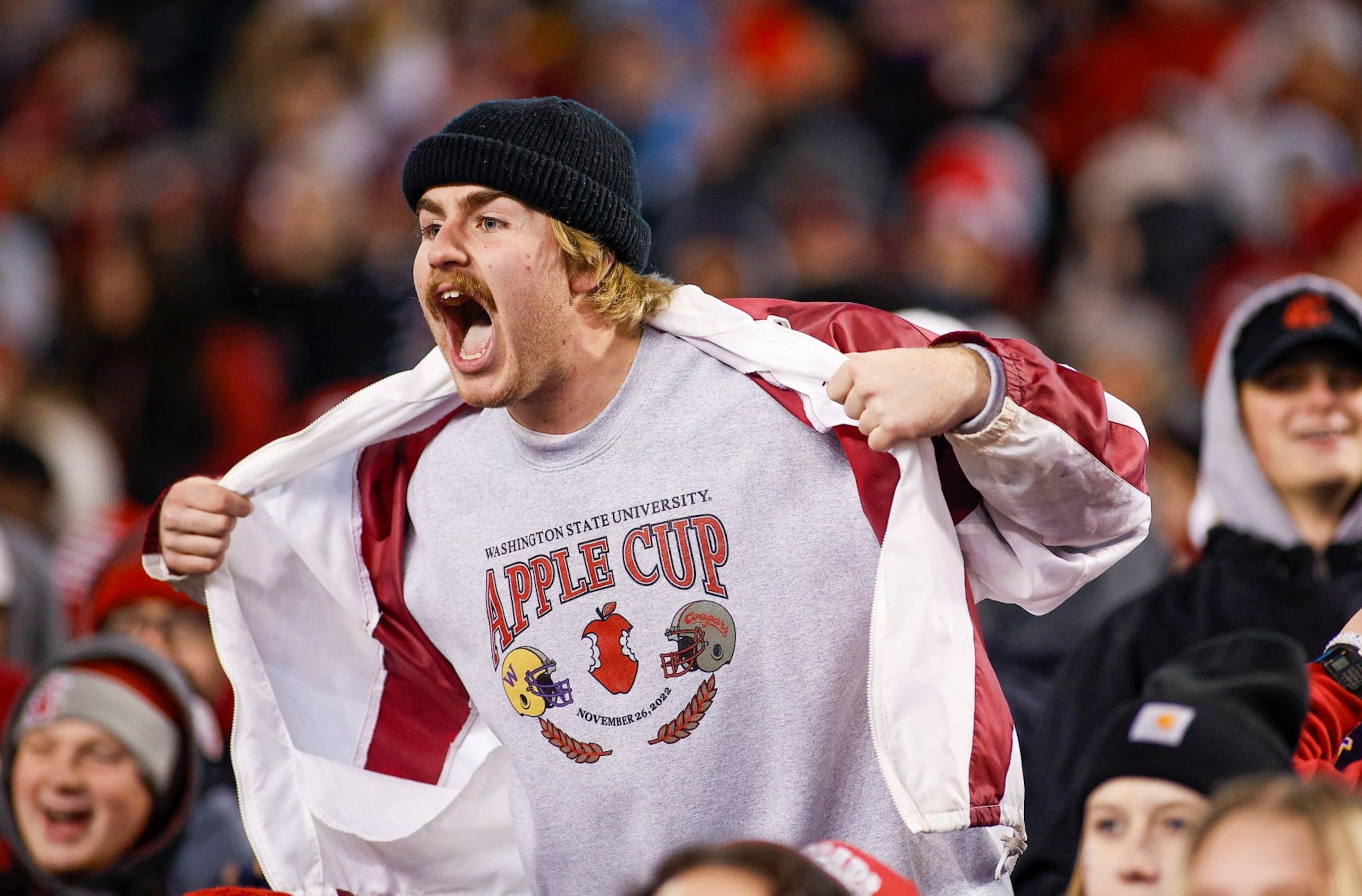 PULLMAN, WA - NOVEMBER 26: A Washington State Cougars fan cheers from the crowd during the game between the Washington Huskies and the Washington State Cougars on November 26, 2022, at Martin Stadium in Pullman, WA. (Photo by Oliver McKenna/Icon Sportswire via Getty Images)