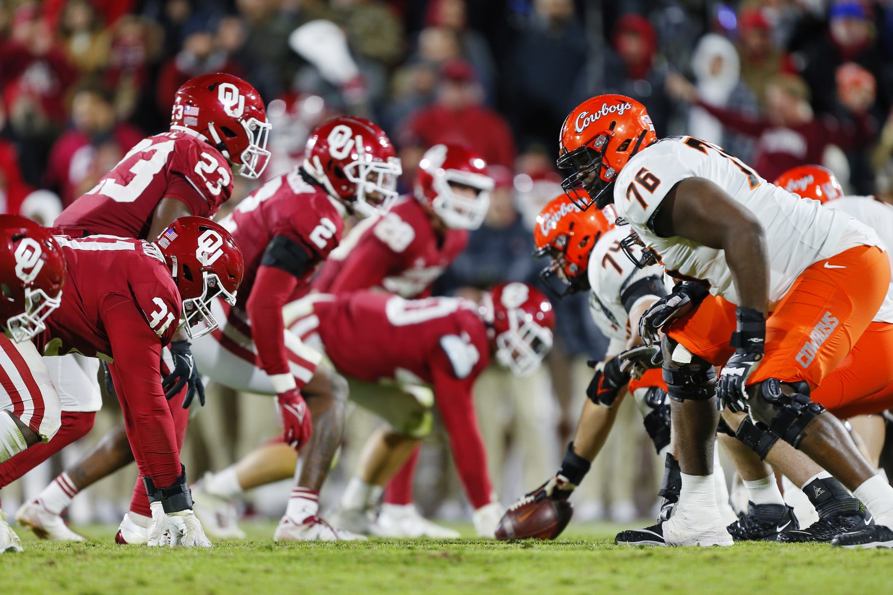 NORMAN, OK - NOVEMBER 19:  Defensive tackle Jalen Redmond #31 and the Oklahoma Sooners defensive line faces off against left tackle Caleb Etienne #76 and the Oklahoma State Cowboys offensive line in the fourth quarter during Bedlam at Gaylord Family Oklahoma Memorial Stadium on November 19, 2022 in Norman, Oklahoma.  The Sooners won 28-13.  (Photo by Brian Bahr/Getty Images)