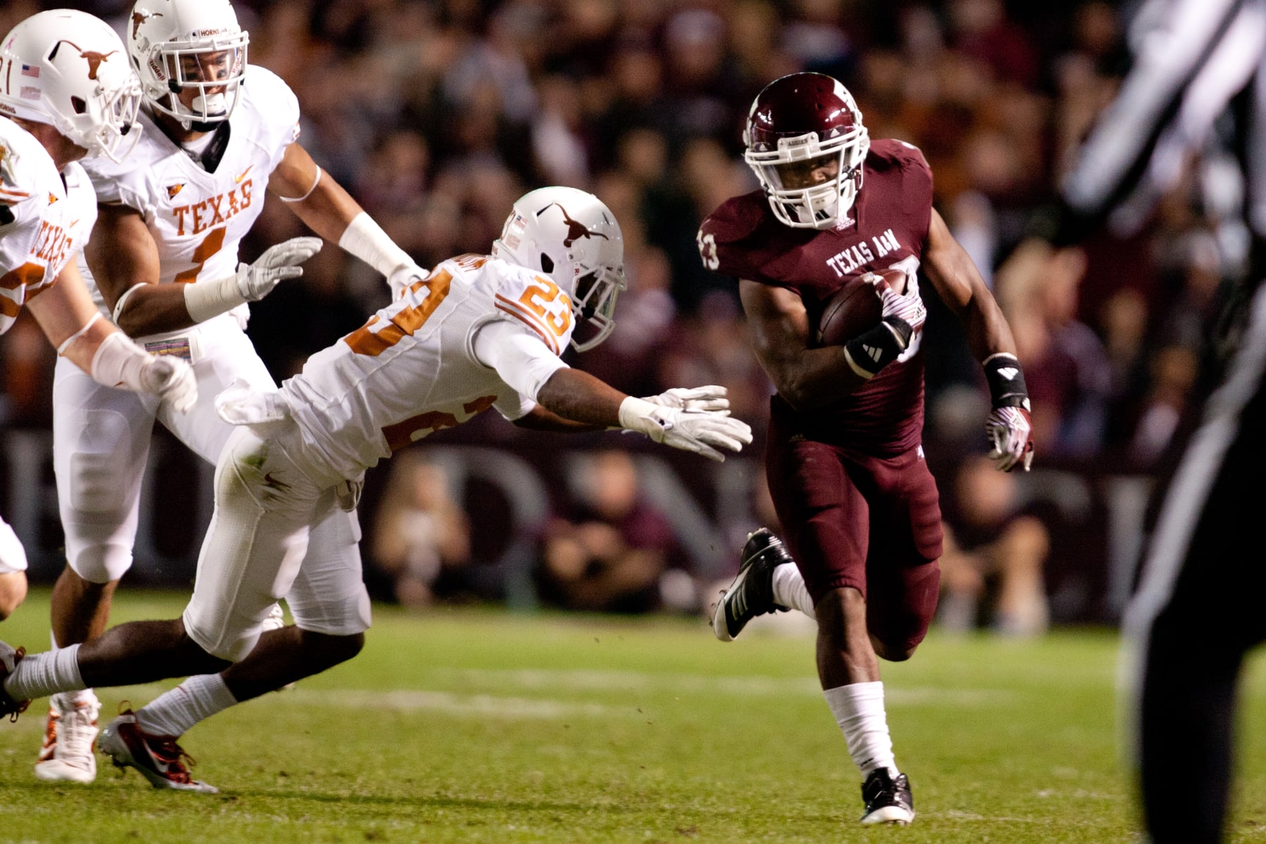 COLLEGE STATION, TX - NOVEMBER 24:  Ben Malena #23 of the Texas A&M Aggies rushes against the Texas Longhorns in the first half of a game at Kyle Field on November 24, 2011 in College Station, Texas. (Photo by Darren Carroll/Getty Images)