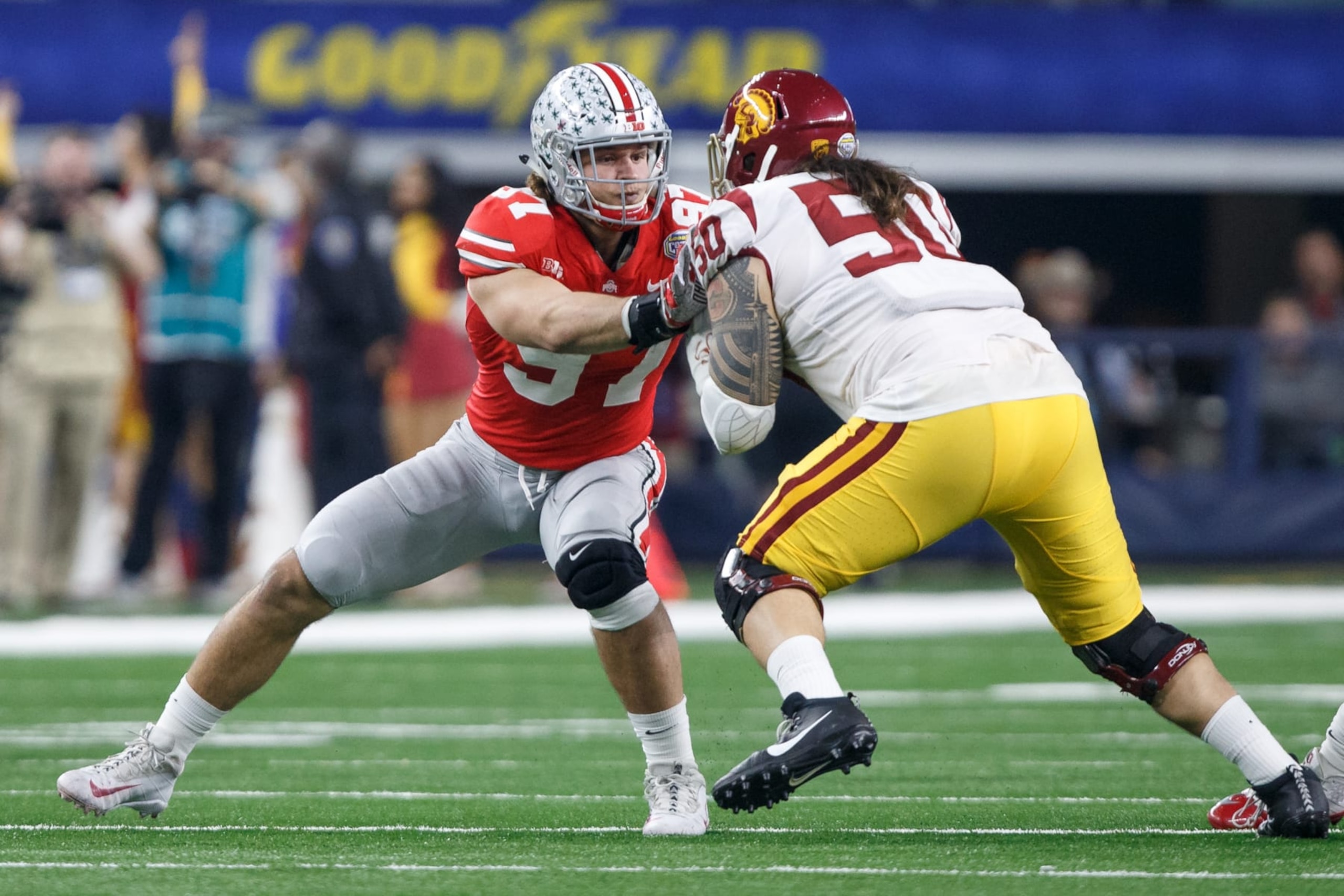 ARLINGTON, TX - DECEMBER 29: Ohio State Buckeyes defensive end Nick Bosa (#97) battles with USC Trojans tackle Toa Lobendahn (#50) during the Cotton Bowl Classic matchup between the USC Trojans and Ohio State Buckeyes on December 29, 2017, at the AT&T Stadium in Arlington, TX. Ohio State won the game 24-7. (Photo by Matthew Visinsky/Icon Sportswire via Getty Images) ARLINGTON, TX - DECEMBER 29: Ohio State Buckeyes defensive end Nick Bosa (#97) battles with USC Trojans tackle Toa Lobendahn (#50) during the Cotton Bowl Classic matchup between the USC Trojans and Ohio State Buckeyes on December 29, 2017, at the AT&T Stadium in Arlington, TX. Ohio State won the game 24-7. (Photo by Matthew Visinsky/Icon Sportswire via Getty Images)