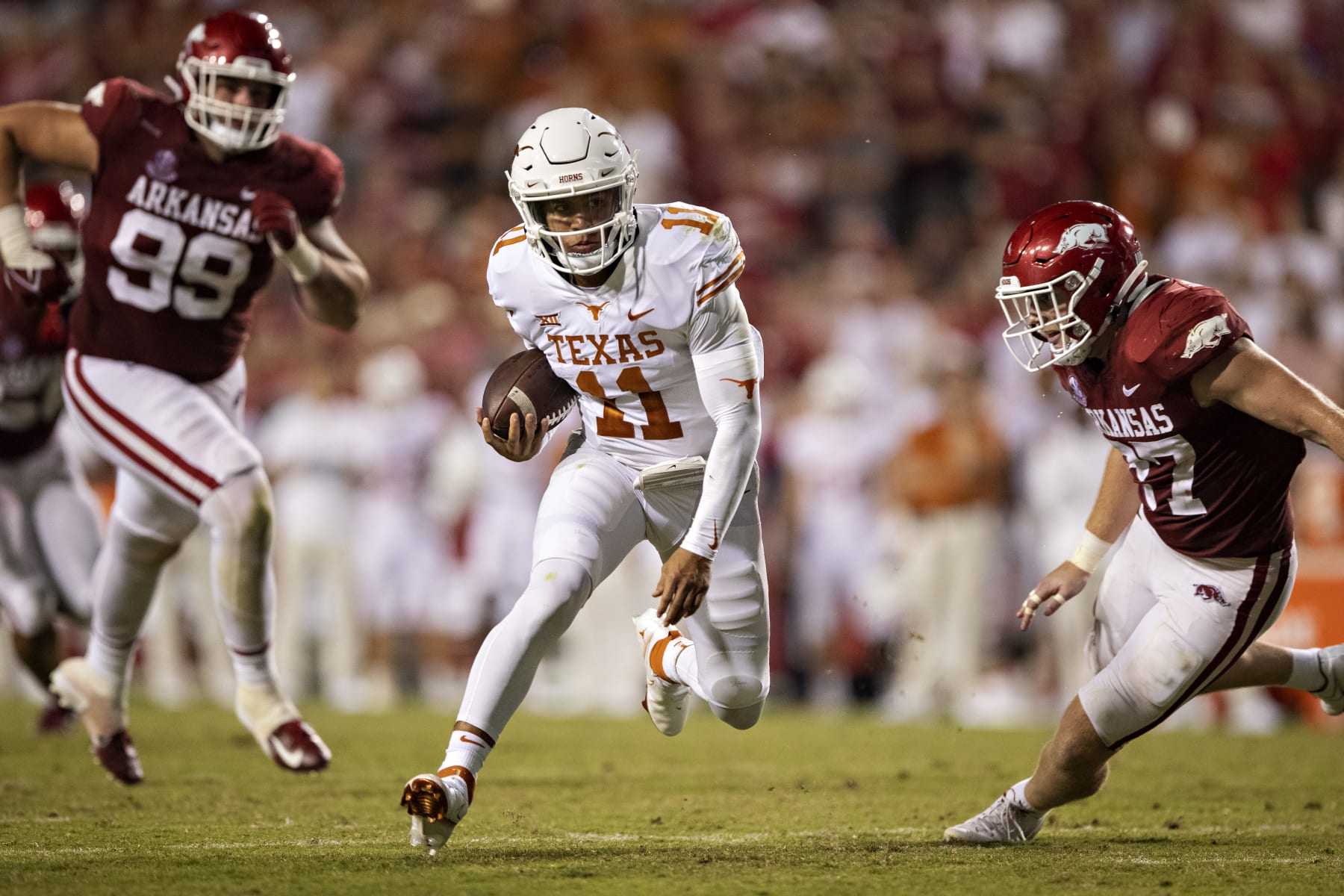 FAYETTEVILLE, AR - SEPTEMBER 11:  Casey Thompson #11 of the Texas Longhorns runs the ball during a game against the Arkansas Razorbacks at Donald W. Reynolds Stadium on September 11, 2021 in Fayetteville, Arkansas.  The Razorbacks defeated the Longhorns 21-40.  (Photo by Wesley Hitt/Getty Images)