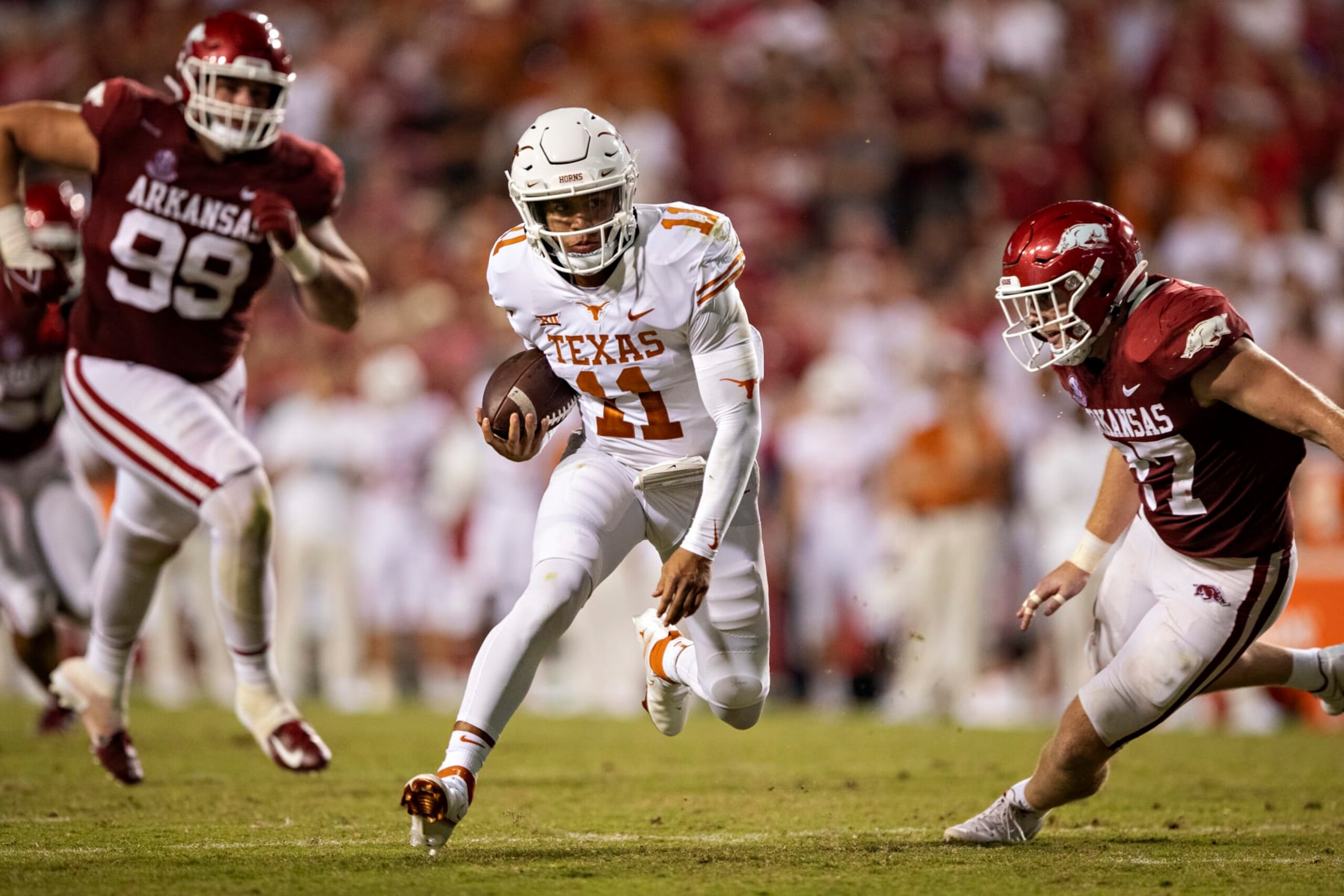 FAYETTEVILLE, AR - SEPTEMBER 11: Casey Thompson #11 of the Texas Longhorns runs the ball during a game against the Arkansas Razorbacks at Donald W. Reynolds Stadium on September 11, 2021 in Fayetteville, Arkansas. The Razorbacks defeated the Longhorns 21-40. (Photo by Wesley Hitt/Getty Images) FAYETTEVILLE, AR - SEPTEMBER 11: Casey Thompson #11 of the Texas Longhorns runs the ball during a game against the Arkansas Razorbacks at Donald W. Reynolds Stadium on September 11, 2021 in Fayetteville, Arkansas. The Razorbacks defeated the Longhorns 21-40. (Photo by Wesley Hitt/Getty Images)