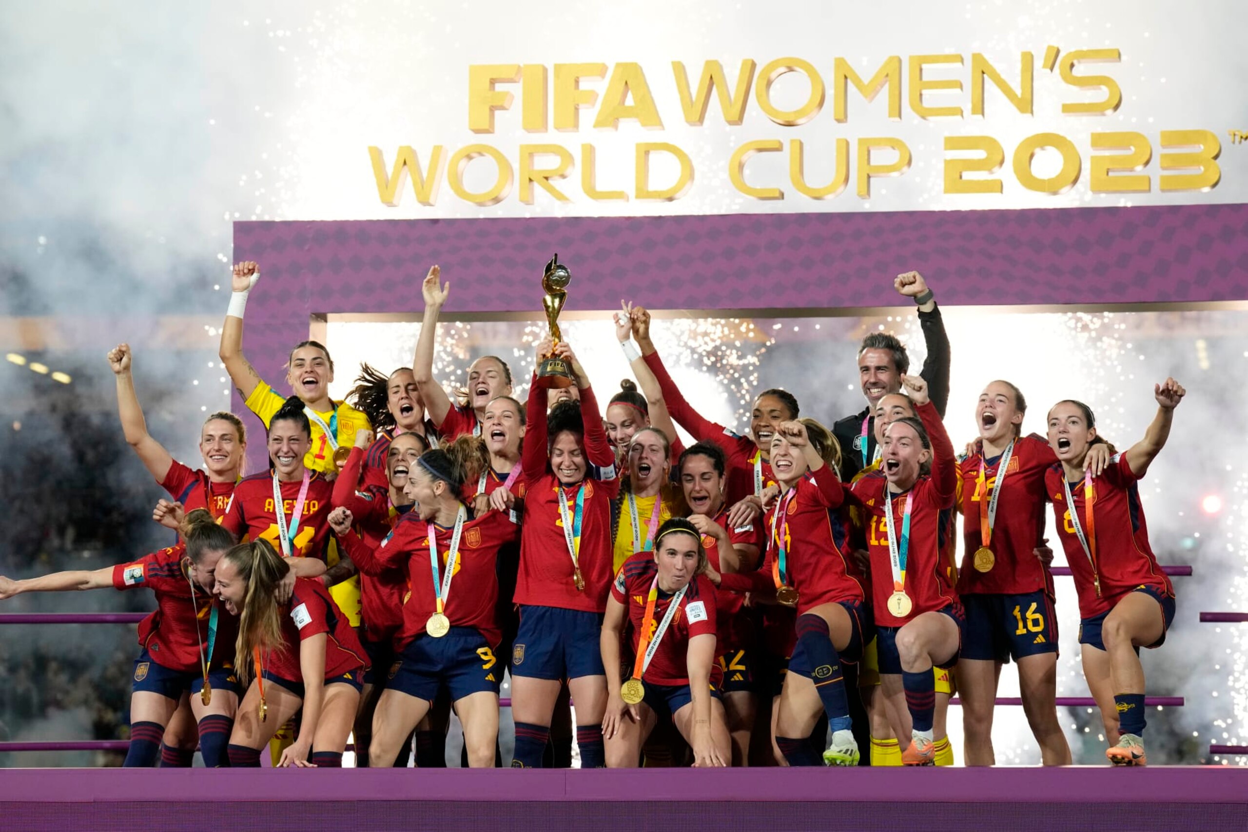 Team Spain celebrates with the trophy after winning the Women's World Cup soccer final against England at Stadium Australia in Sydney, Australia, Sunday, Aug. 20, 2023. (AP Photo/Alessandra Tarantino)