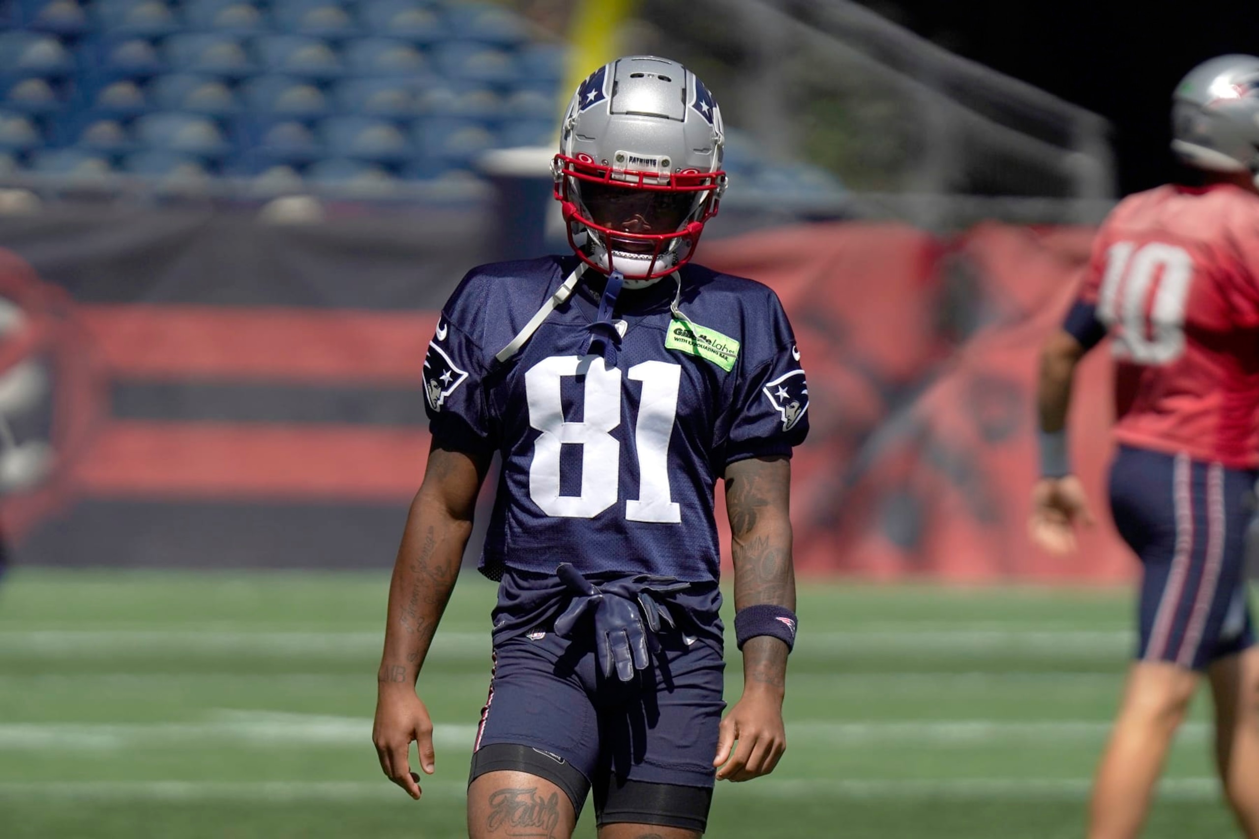 New England Patriots wide receiver Demario Douglas (81) warms up during an NFL football practice, Thursday, Aug. 31, 2023, in Foxborough, Mass. (AP Photo/Steven Senne)