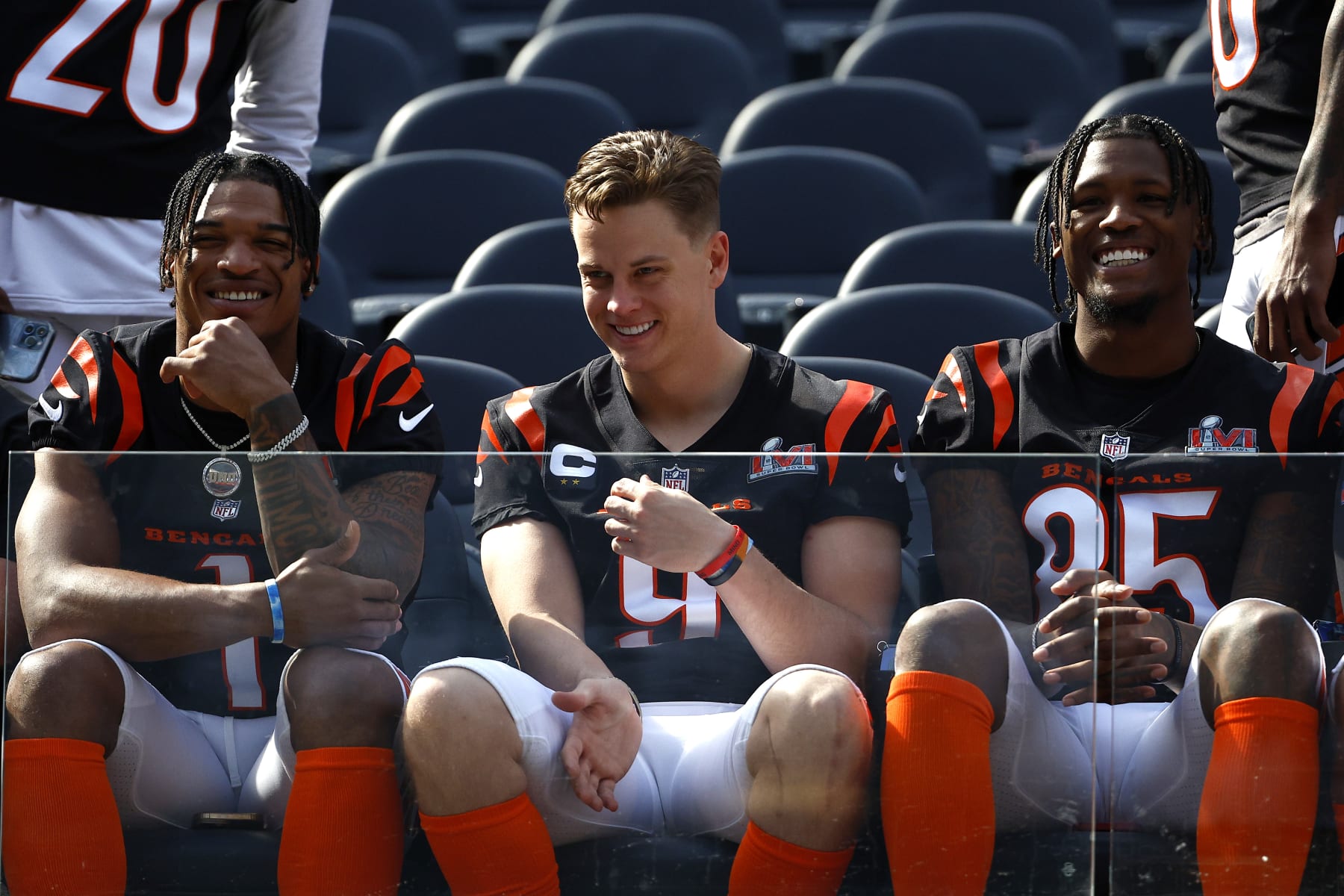 LOS ANGELES, CALIFORNIA - FEBRUARY 12: L-R Ja'Marr Chase #1, Joe Burrow #9 and Tee Higgins #85 of the Cincinnati Bengals sit in the front for the Cincinnati Bengals team photo at UCLA's Drake Stadium on February 12, 2022 in Los Angeles, California. The Bengals will play against the Los Angeles Rams in Super Bowl LVI on February 13. (Photo by Ronald Martinez/Getty Images)