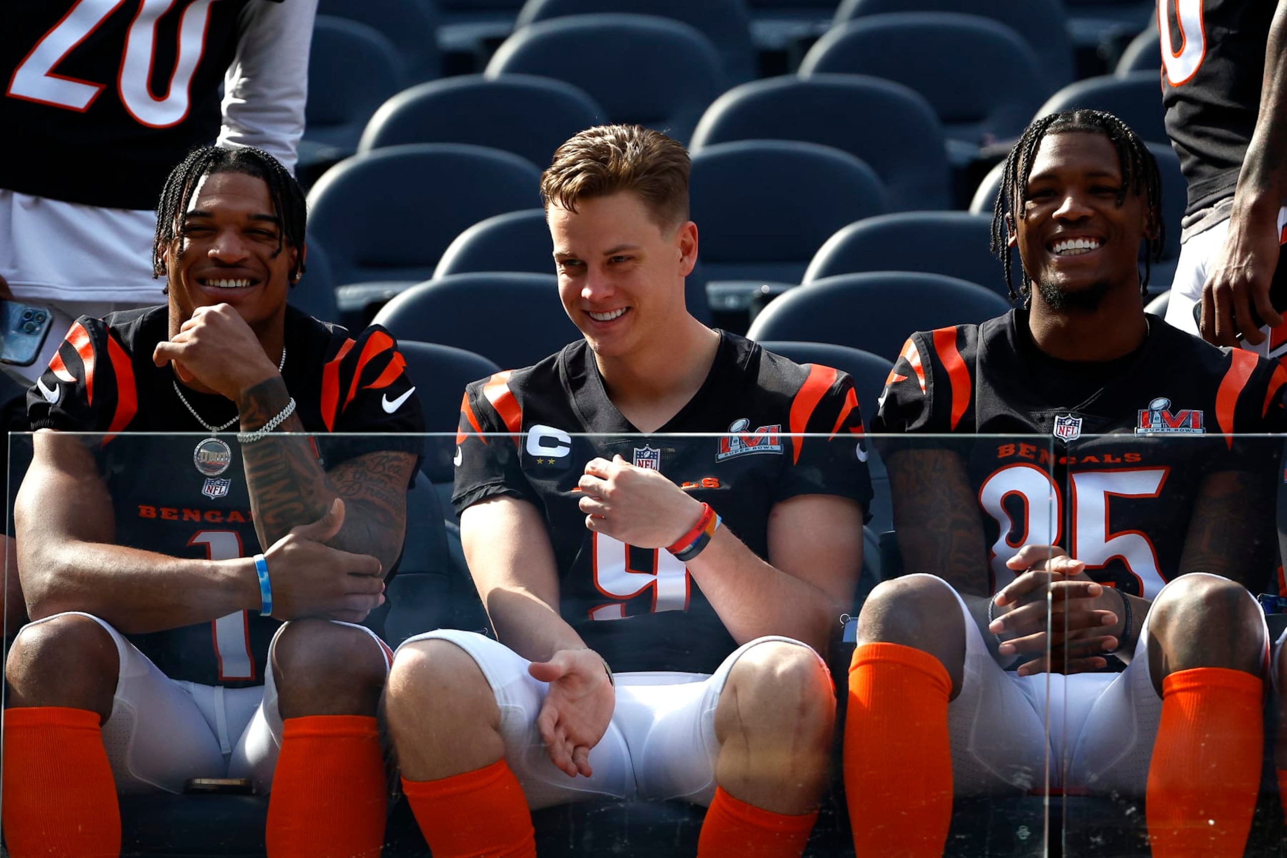 LOS ANGELES, CALIFORNIA - FEBRUARY 12: L-R Ja'Marr Chase #1, Joe Burrow #9 and Tee Higgins #85 of the Cincinnati Bengals sit in the front for the Cincinnati Bengals team photo at UCLA's Drake Stadium on February 12, 2022 in Los Angeles, California. The Bengals will play against the Los Angeles Rams in Super Bowl LVI on February 13. (Photo by Ronald Martinez/Getty Images)
