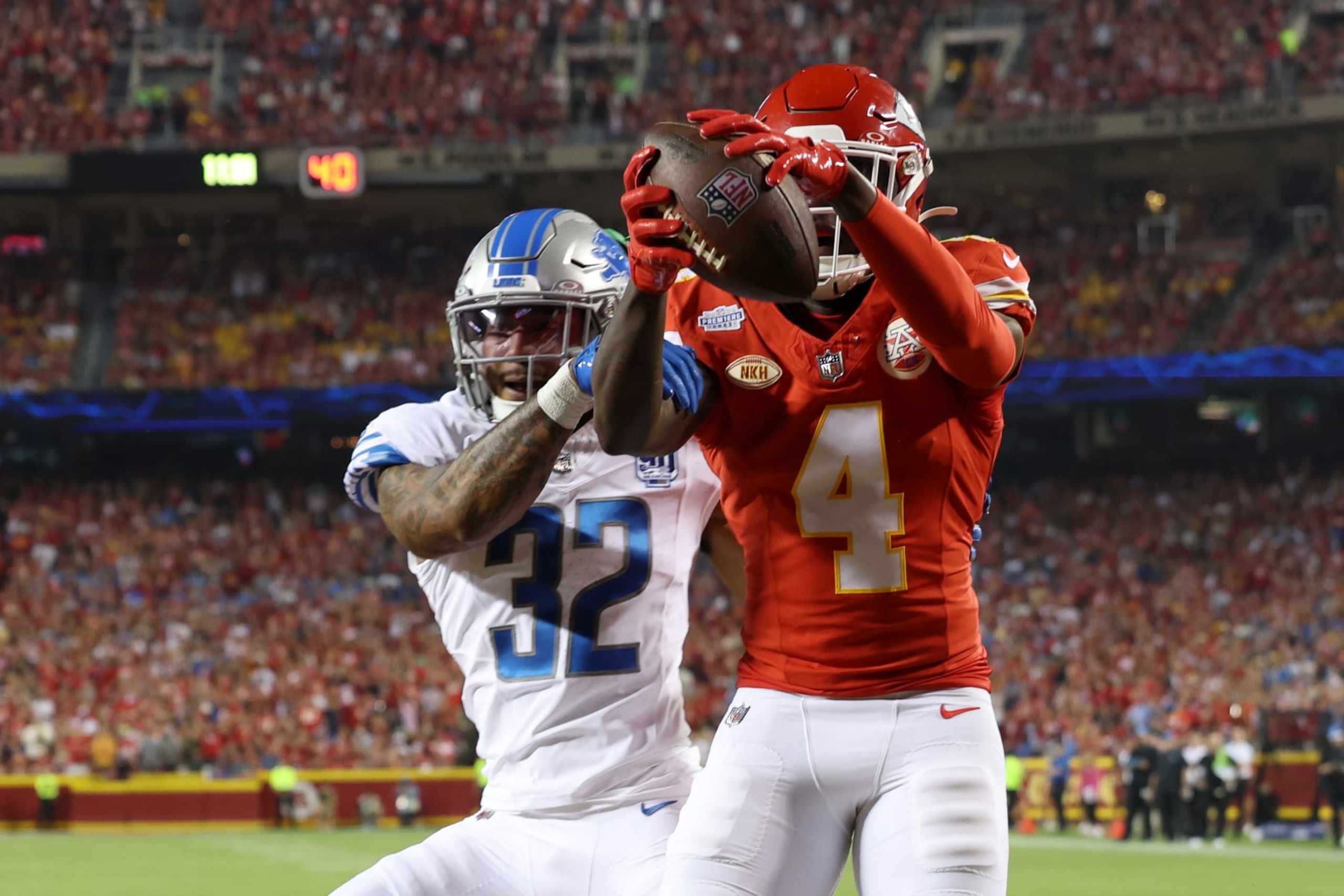 KANSAS CITY, MISSOURI - SEPTEMBER 07: Rashee Rice #4 of the Kansas City Chiefs completes a touchdown reception against the defense of Brian Branch #32 of the Detroit Lions second quarter  at GEHA Field at Arrowhead Stadium on September 07, 2023 in Kansas City, Missouri. (Photo by Jamie Squire/Getty Images)
