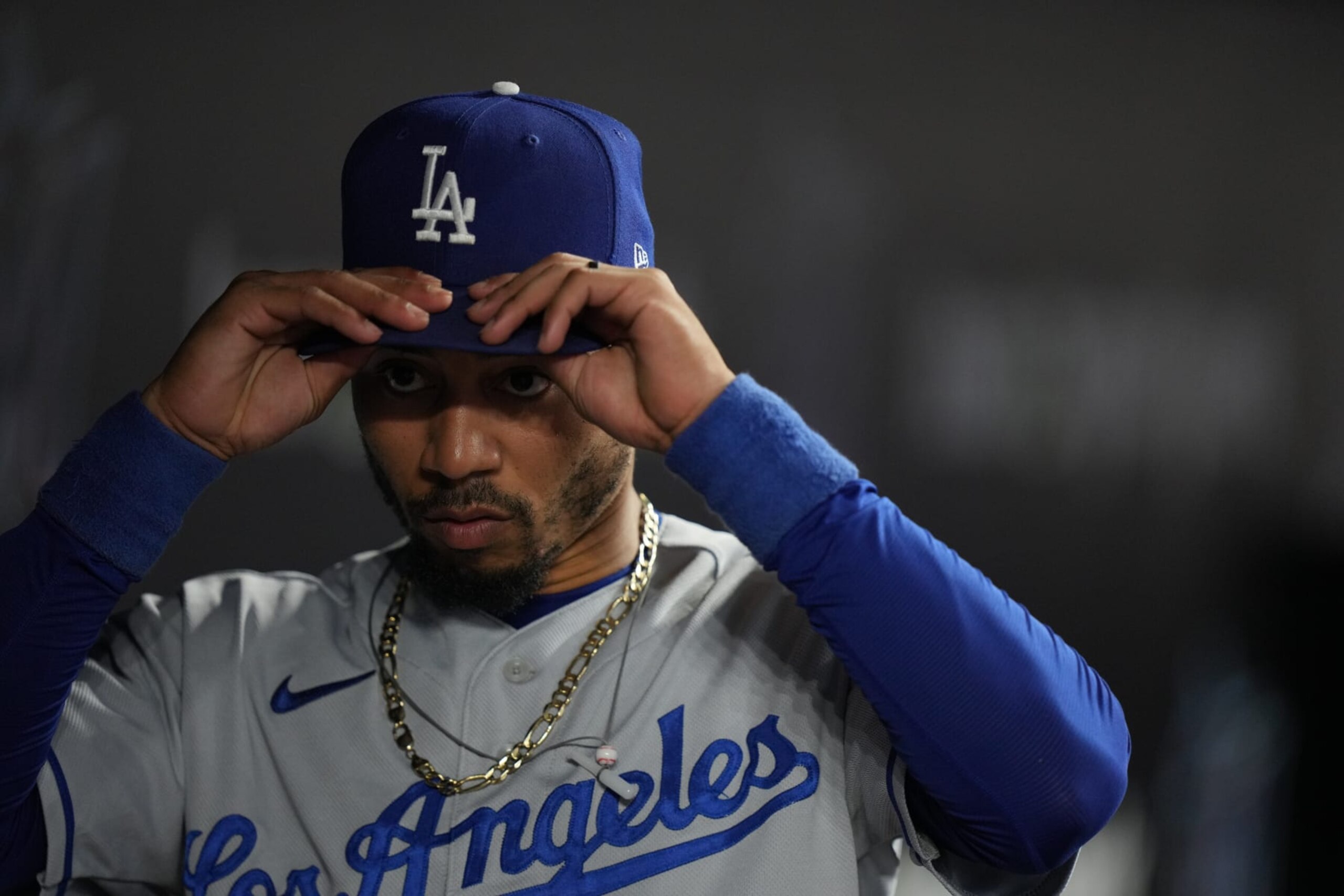 MIAMI, FL - SEPTEMBER 05: Los Angeles Dodgers right fielder Mookie Betts (50) adjusts his cap in the dugout before going to the outfield during the game between the Los Angeles Dodgers and the Miami Marlins on Tuesday, September 5, 2023 at LoanDepot Park, Miami, Fla. (Photo by Peter Joneleit/Icon Sportswire via Getty Images) MIAMI, FL - SEPTEMBER 05: Los Angeles Dodgers right fielder Mookie Betts (50) adjusts his cap in the dugout before going to the outfield during the game between the Los Angeles Dodgers and the Miami Marlins on Tuesday, September 5, 2023 at LoanDepot Park, Miami, Fla. (Photo by Peter Joneleit/Icon Sportswire via Getty Images)