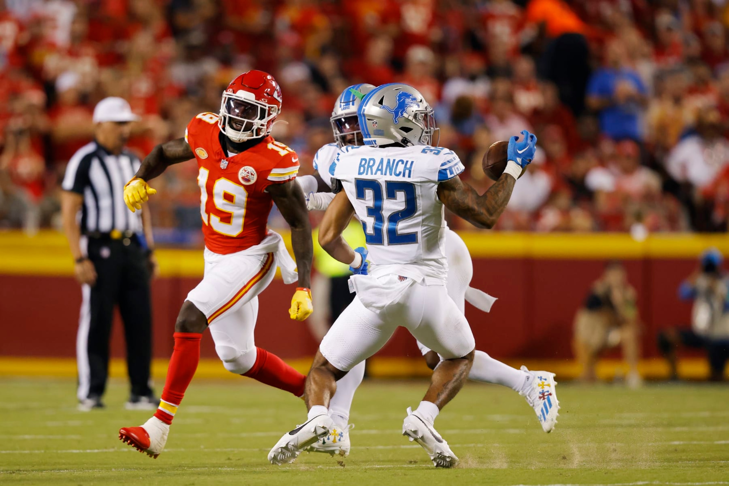 KANSAS CITY, MISSOURI - SEPTEMBER 07: Brian Branch #32 of the Detroit Lions intercepts a pass intended for Kadarius Toney #19 of the Kansas City Chiefs for a touchdown in the third quarter at GEHA Field at Arrowhead Stadium on September 07, 2023 in Kansas City, Missouri. (Photo by David Eulitt/Getty Images)
