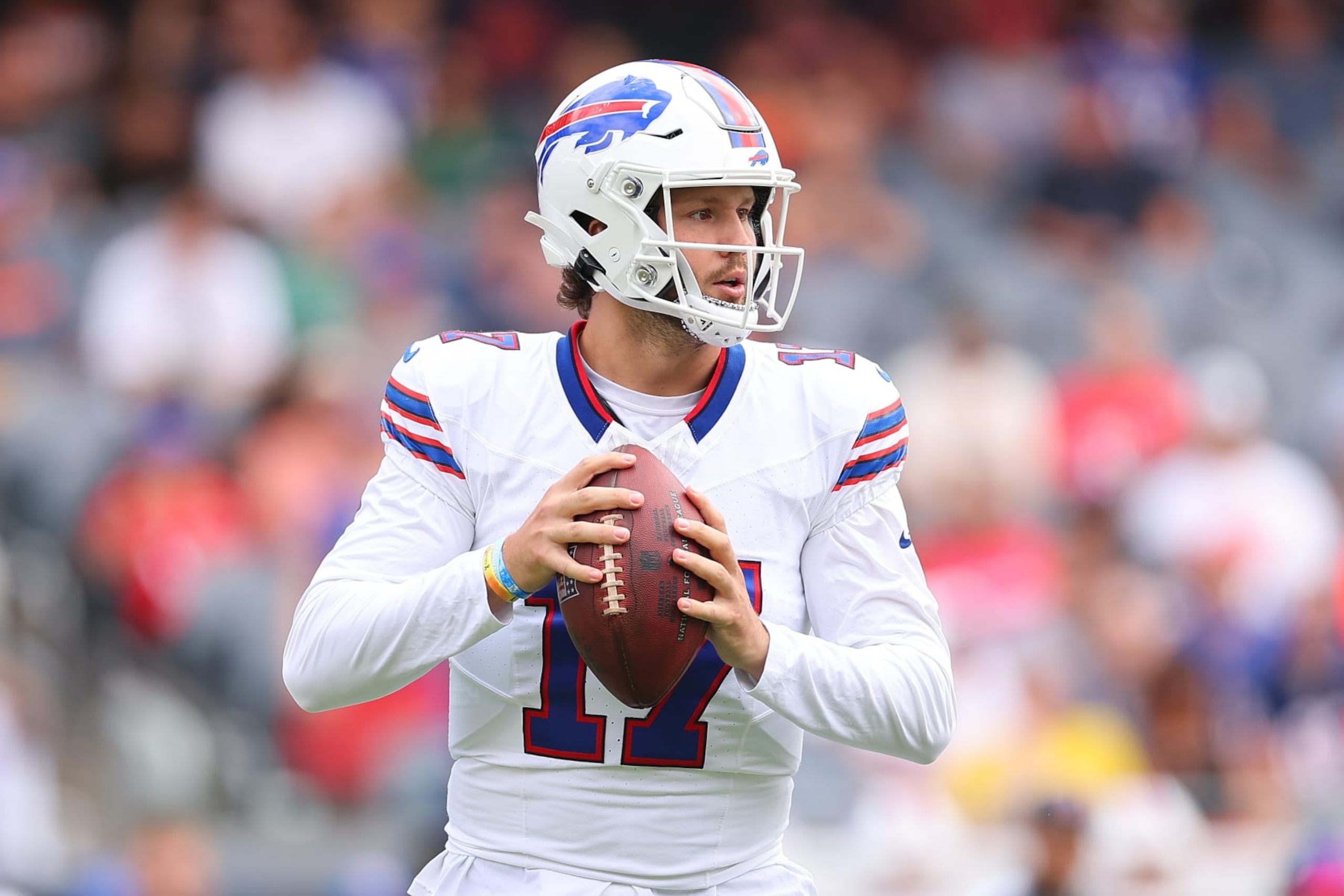 CHICAGO, ILLINOIS - AUGUST 26: Josh Allen #17 of the Buffalo Bills looks to pass against the Chicago Bears during the first half of a preseason game at Soldier Field on August 26, 2023 in Chicago, Illinois. (Photo by Michael Reaves/Getty Images)