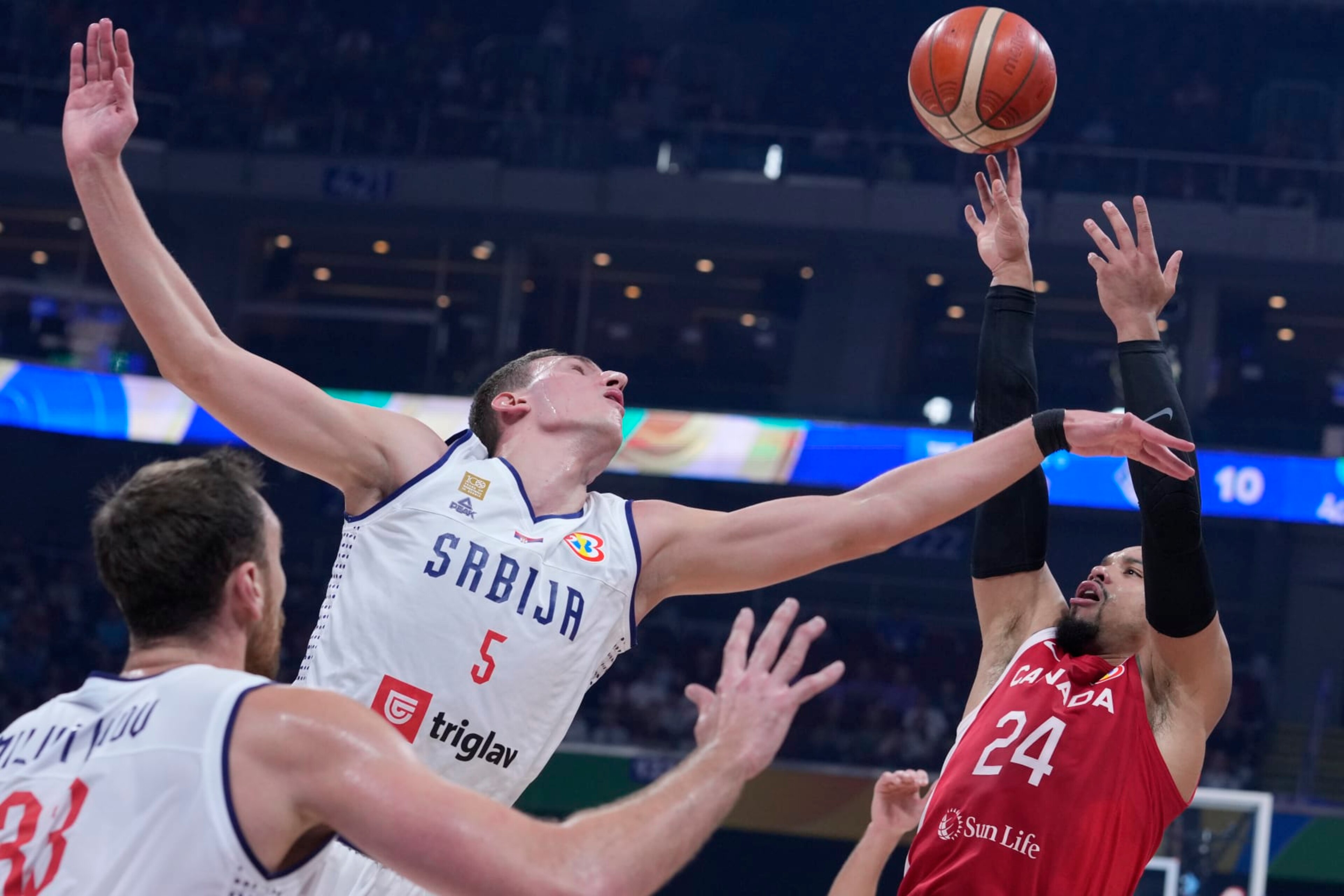 Serbia forward Nikola Jovic, left, attempts to block a shot by Canada forward Dillon Brooks during a Basketball World Cup semi final game in Manila, Philippines, Friday, Sept. 8, 2023. (AP Photo/Michael Conroy) Serbia forward Nikola Jovic, left, attempts to block a shot by Canada forward Dillon Brooks during a Basketball World Cup semi final game in Manila, Philippines, Friday, Sept. 8, 2023. (AP Photo/Michael Conroy)