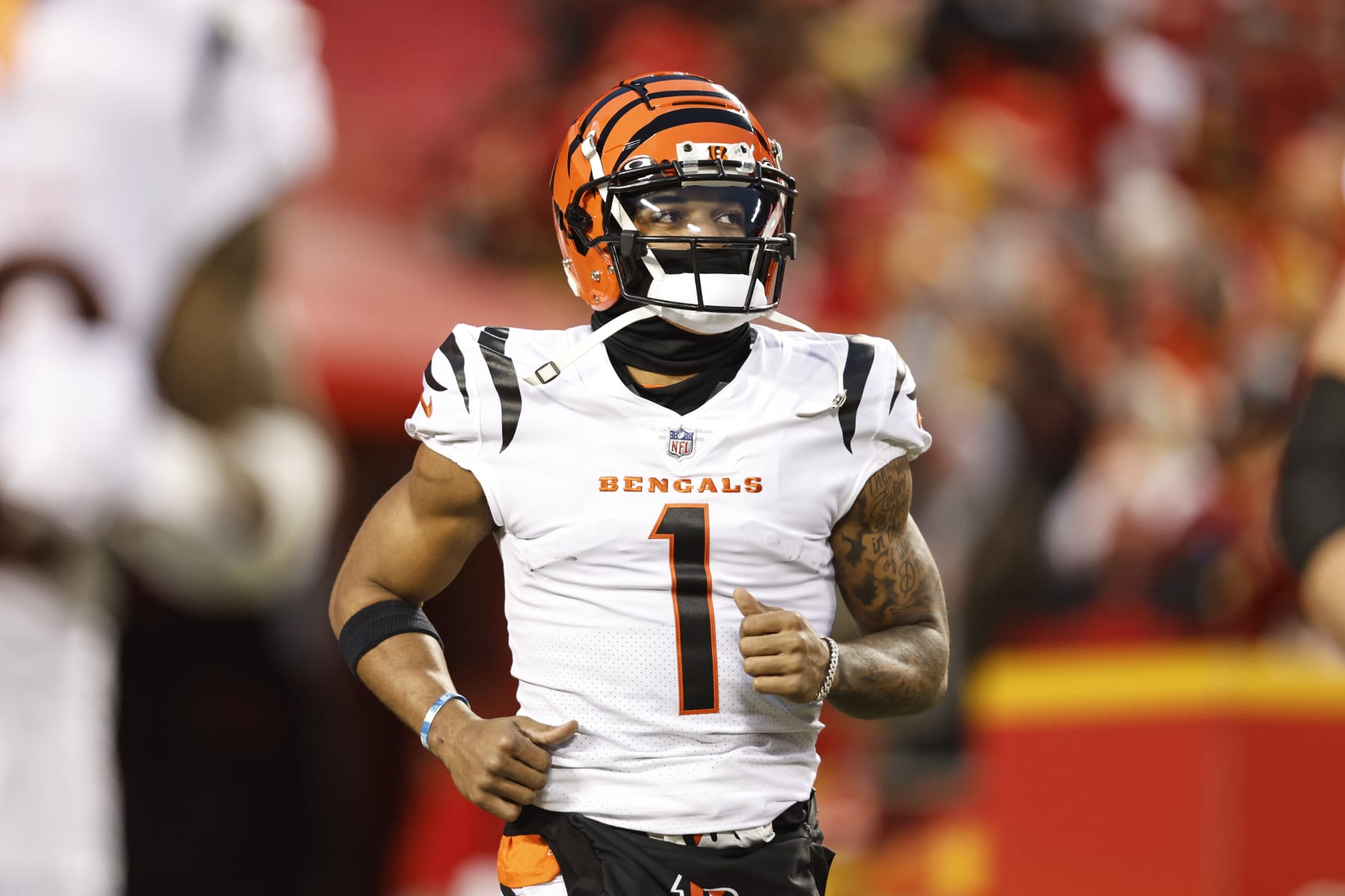 KANSAS CITY, MISSOURI - JANUARY 29: Ja'Marr Chase #1 of the Cincinnati Bengals runs as he takes the field prior to the AFC Championship NFL football game between the Kansas City Chiefs and the Cincinnati Bengals at GEHA Field at Arrowhead Stadium on January 29, 2023 in Kansas City, Missouri. (Photo by Michael Owens/Getty Images)