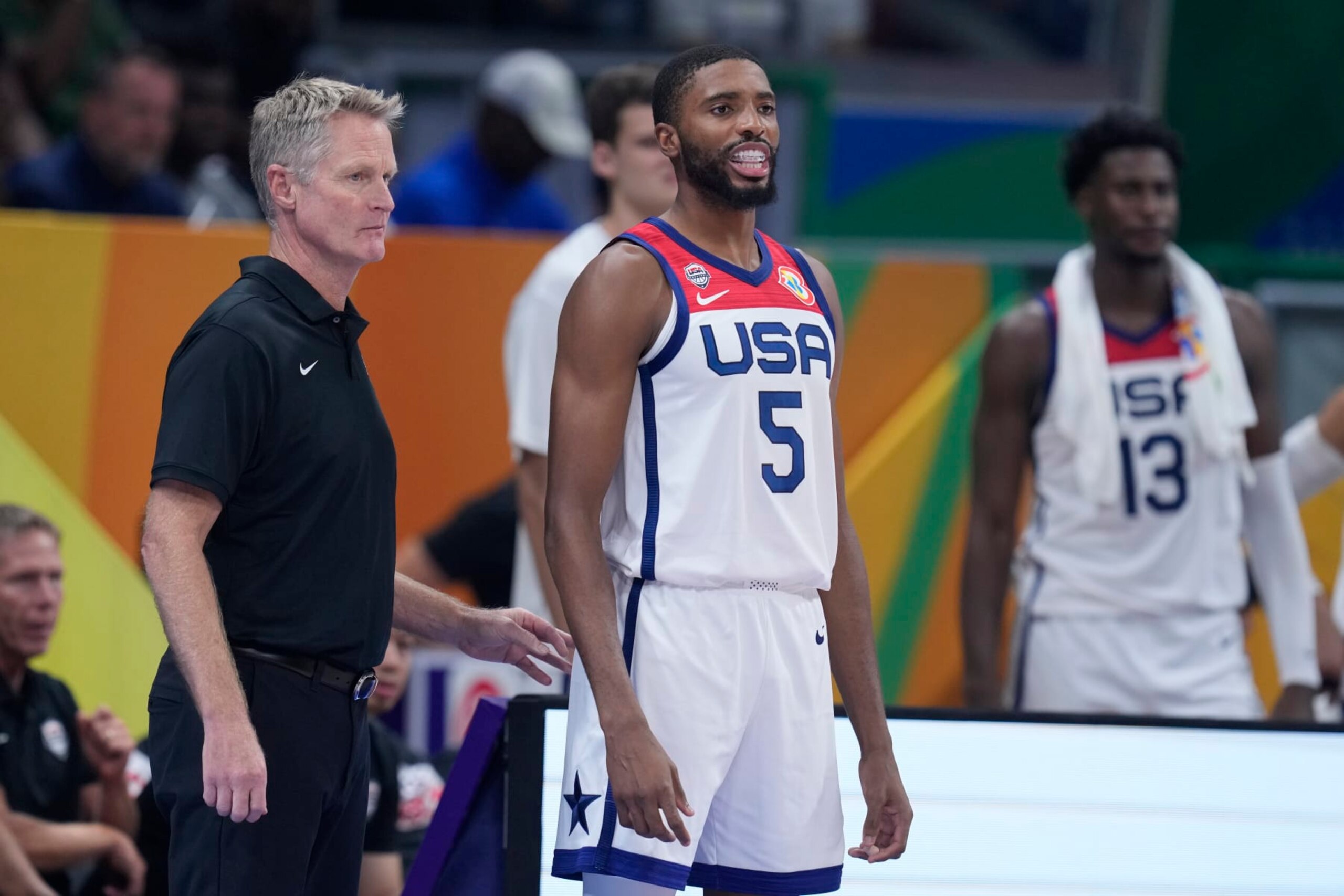 U.S. head coach Steve Kerr, left, stands beside forward Mikal Bridges during a Basketball World Cup semi final game against Germany in Manila, Philippines, Friday, Sept. 8, 2023. (AP Photo/Michael Conroy)