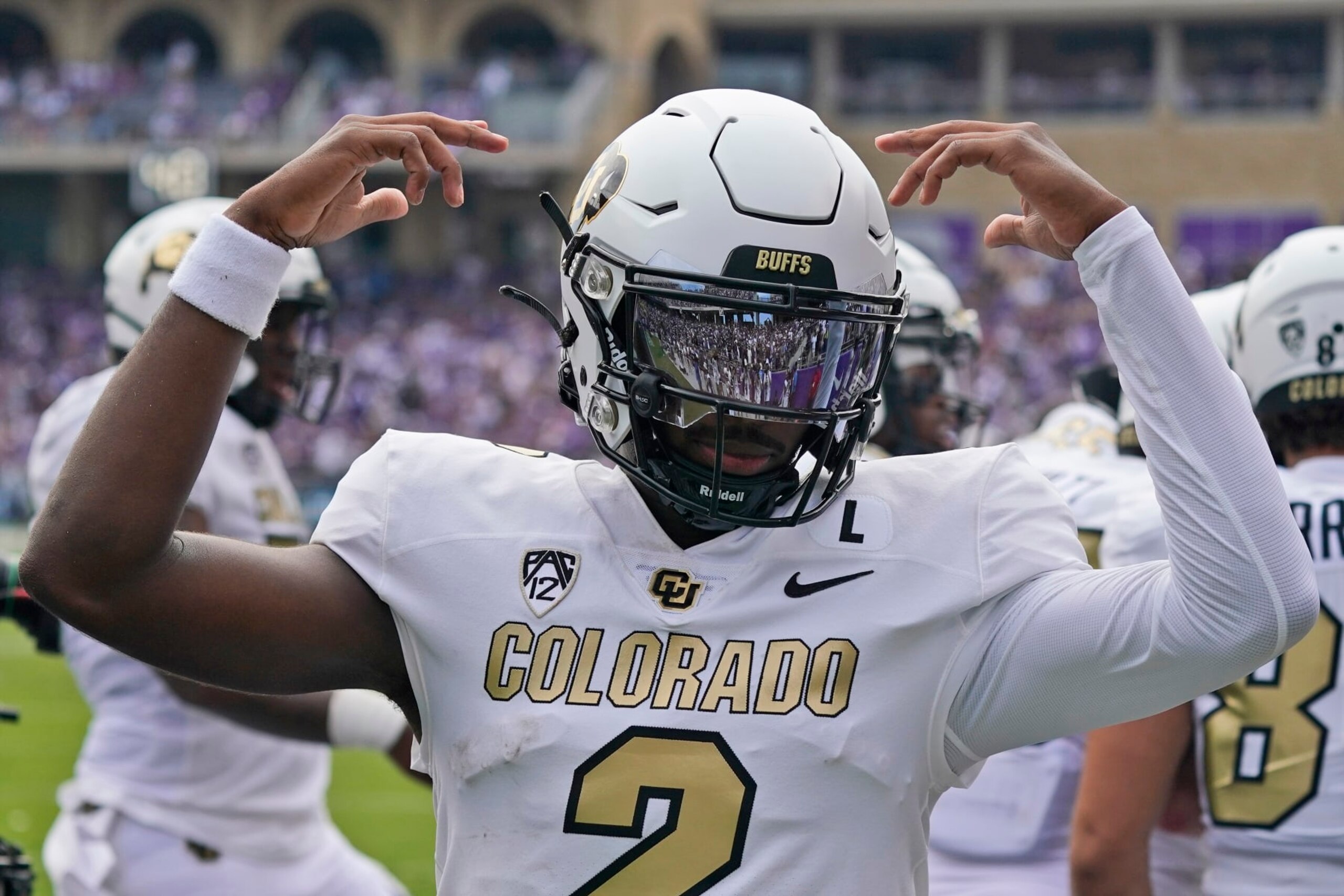 Colorado quarterback Shedeur Sanders (2) celebrates a touchdown during the first half of an NCAA college football game against TCU Saturday, Sept. 2, 2023, in Fort Worth, Texas. (AP Photo/LM Otero)