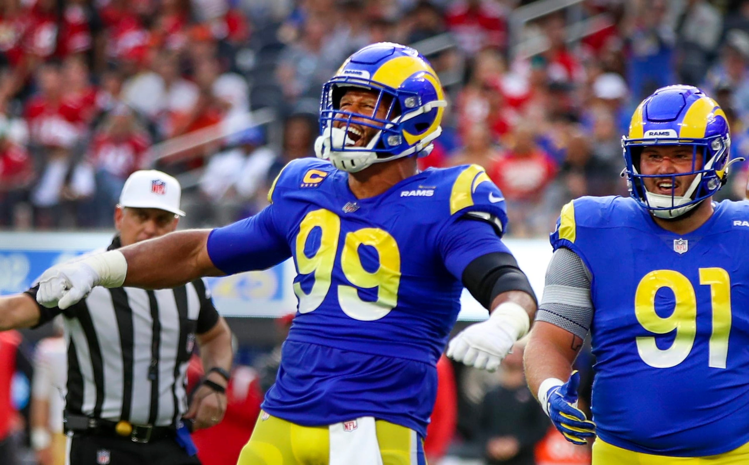 Inglewood, CA - October 30: Rams defensive tackle Aaron Donald, #99, celebrates sacking 49ers quarterback Jimmy Garoppolo as teammate nose tackle Greg Gaines watches in the second half at SoFi Stadium, Inglewood, CA on Sunday, Oct. 30, 2022. The 49ers beat the Rams 31-14.(Allen J. Schaben / Los Angeles Times via Getty Images)